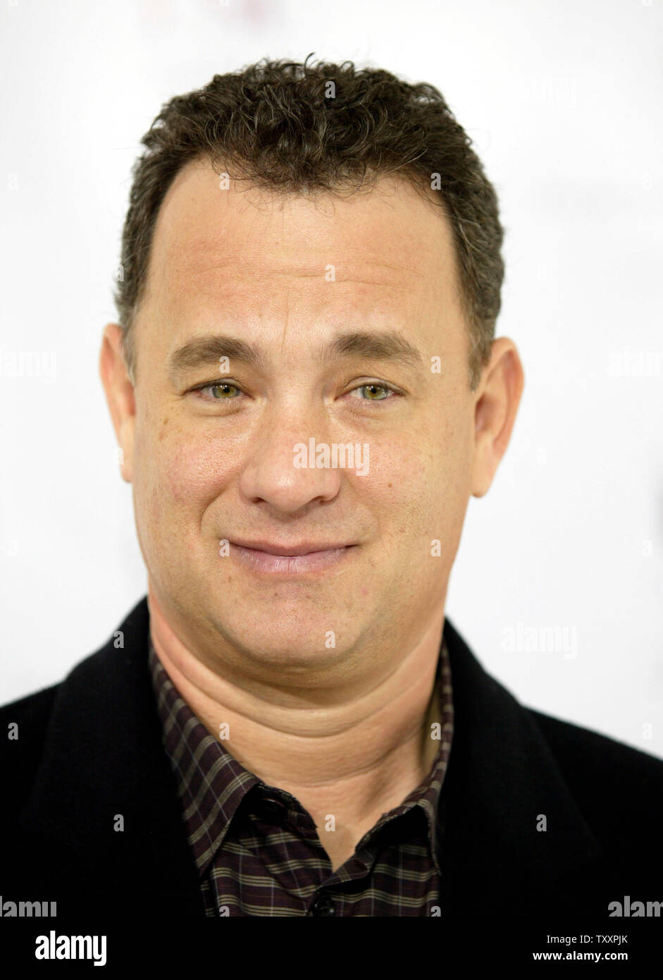 Actor Tom Hanks poses at the November 7, 2004 Los Angeles  premiere of the new animated film 'Polar Express'.The film, starring Hanks ,is  based on the children's book of the same name and directed by Robert Zemeckis, opens in the United States November 10. (UPI Photo/Francis Specker) Stock Photo