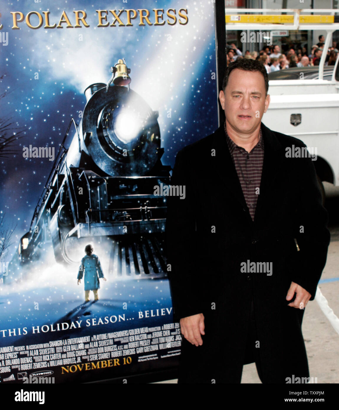 Actor Tom Hanks poses for photographers at the November 7, 2004 Los Angeles  premiere of the new animated film 'Polar Express'.The film, starring Hanks ,is  based on the children's book of the same name and directed by Robert Zemeckis, opens in the United States November 10. (UPI Photo/Francis Specker) Stock Photo