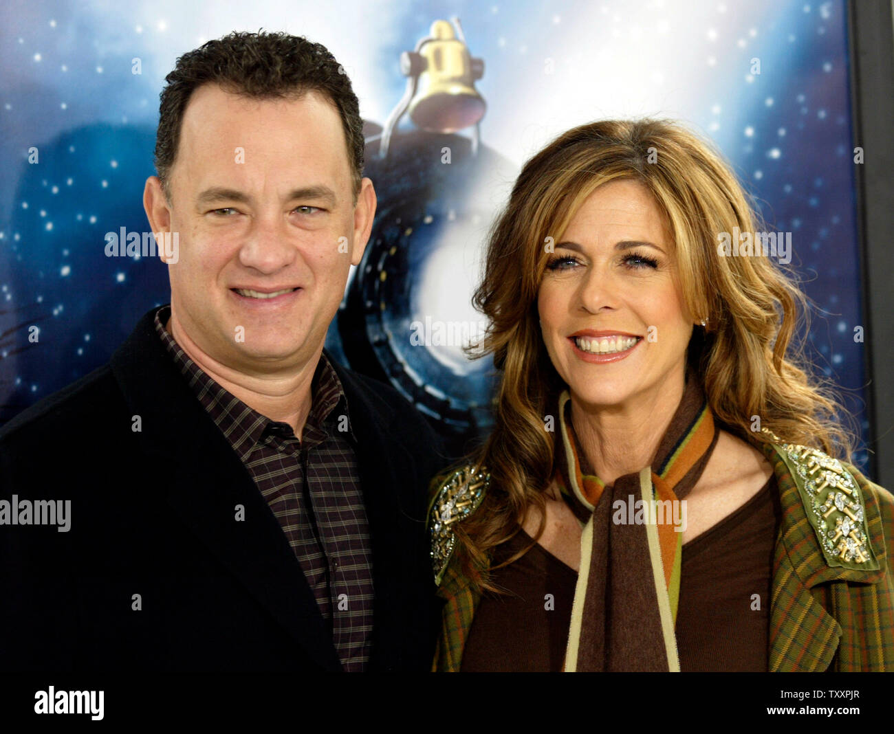 Actor Tom Hanks, left, and his wife, Rita Wilson, pose at the November 7, 2004 Los Angeles  premiere of the new animated film 'Polar Express'. The film, starring Hanks , is based on the children's book of the same name and directed by Robert Zemeckis, opens in the United States November 10. (UPI Photo/Francis Specker) Stock Photo