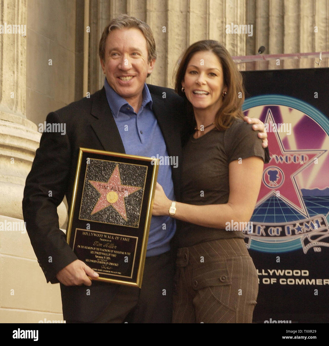 Actor Tim Allen poses with his girlfriend Jane Hajduk atop his newly unveiled star on the Hollywood Walk of Fame during ceremonies along Hollywood Boulevard in Hollywood November 19, 2004. Allen, best known for his comedy television series 'Home Improvement' currently stars in the family comedy film 'Christmas with the Kranks.' (UPI Photo/Jim Ruymen) Stock Photo