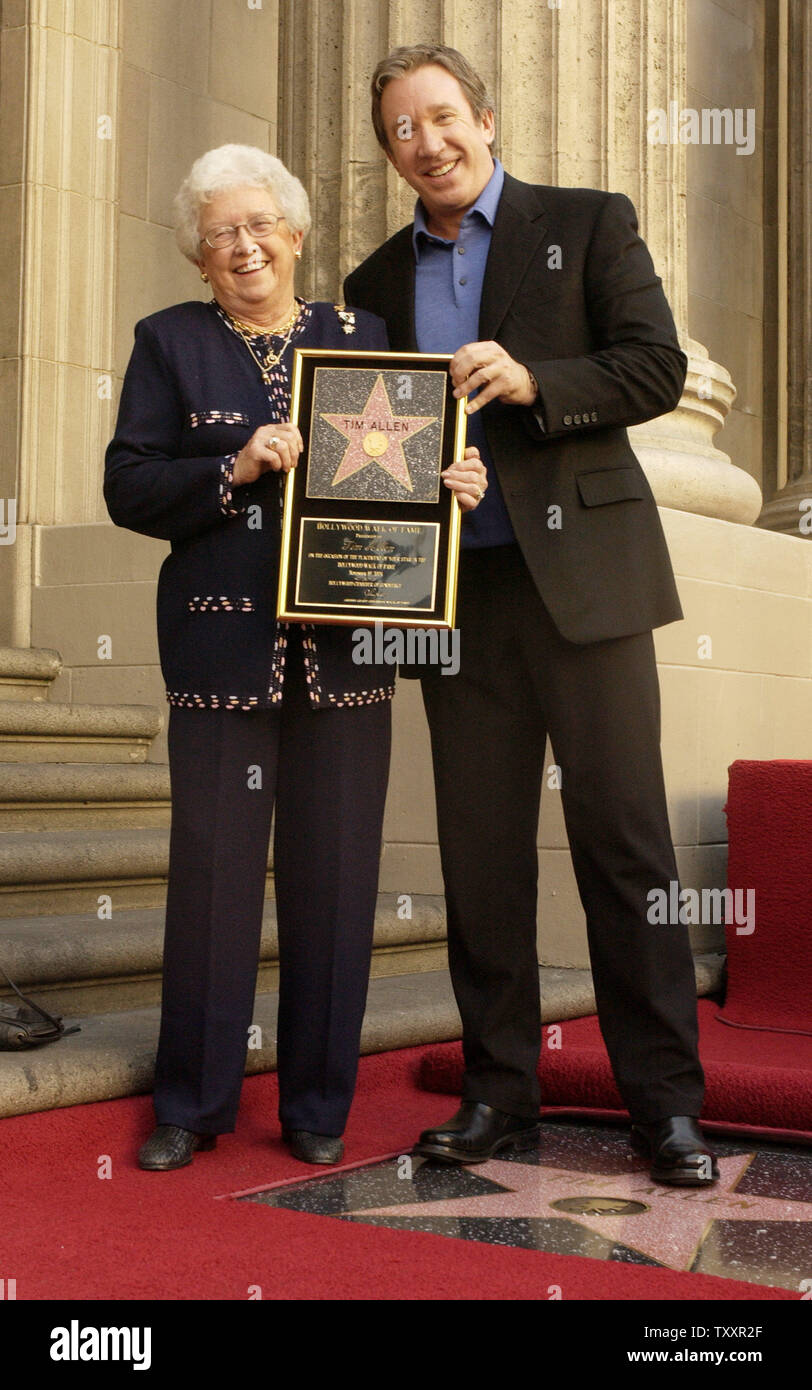 Actor Tim Allen holds a replica plaque with his mother Marty, after his star was unveiled on the Hollywood Walk of Fame during ceremonies along Hollywood Boulevard in Hollywood November 19, 2004. Allen, best known for his comedy television series 'Home Improvement' currently stars in the family comedy film 'Christmas with the Kranks.'  (UPI Photo/Jim Ruymen) Stock Photo