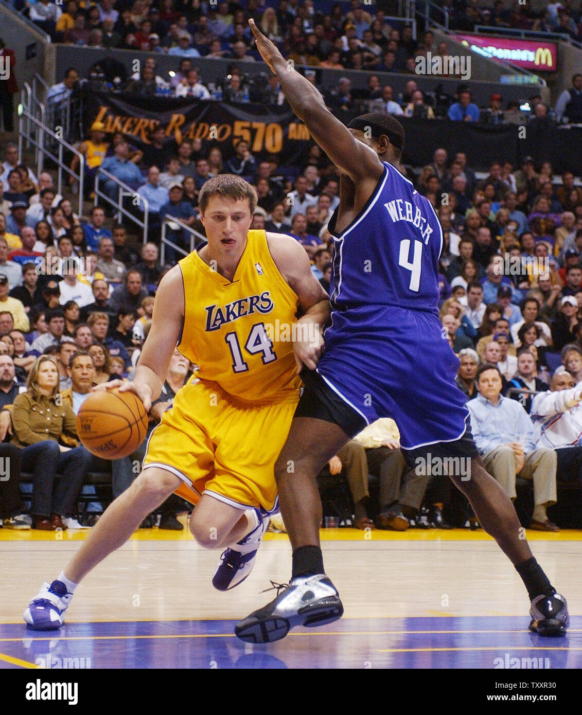 The Sacramento Kings' Vlade Divac (center) picks up his sixth foul in the  fourth quarter as he and teammate Hedo Turkoglu (left) try to get the ball  from the Los Angeles LAkers