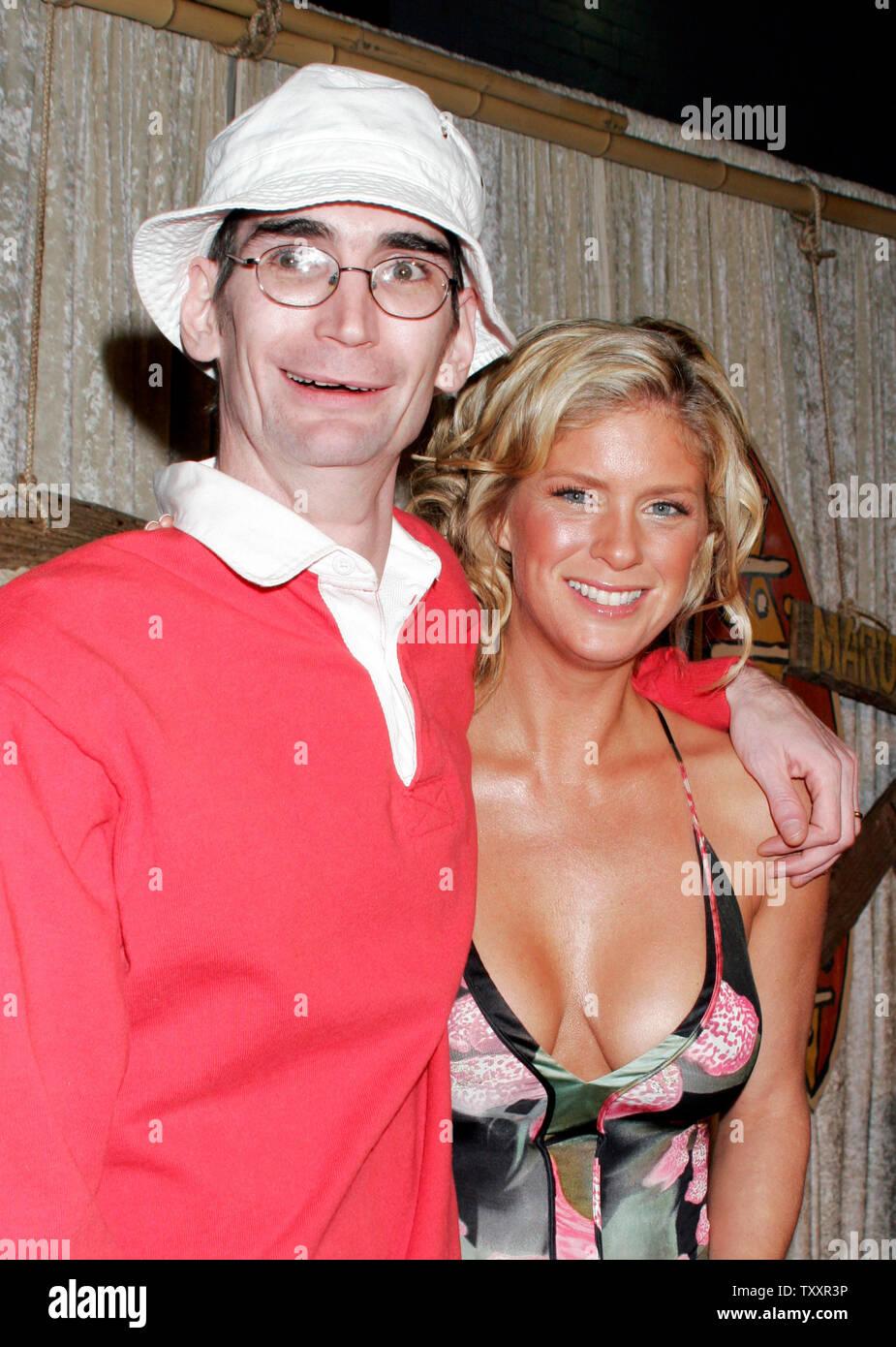 Mark Groesbeck, left, in the role of 'Gilligan', and actress Rachel Hunter, in the role of 'Ginger' arrive at the cast party of a new reality series, 'The Real Gilligan's Island' at the Pearl night club in Los Angeles,  November 30, 2004. (UPI Photo/Francis Specker) Stock Photo