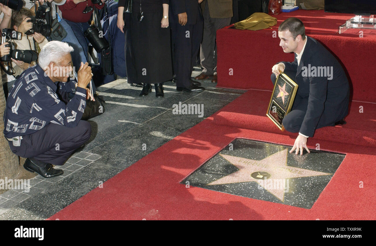 Actor Freddie Prinze, Jr. reaches out to touch the newly unveiled star ...
