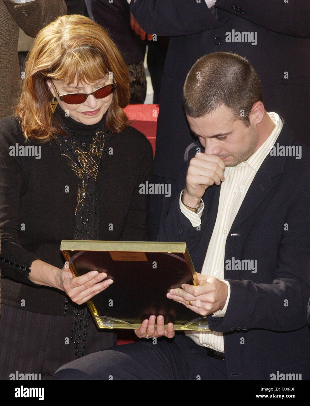Actor Freddie Prinze, Jr. and his mother Kathy choke up while looking