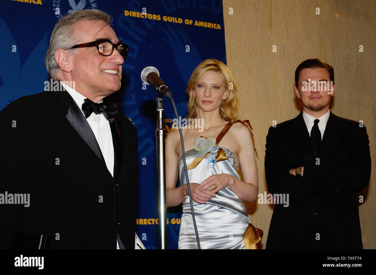 "The Aviator" stars Cate Blanchett (C) and Leonardo DiCaprio (R) listen(00)