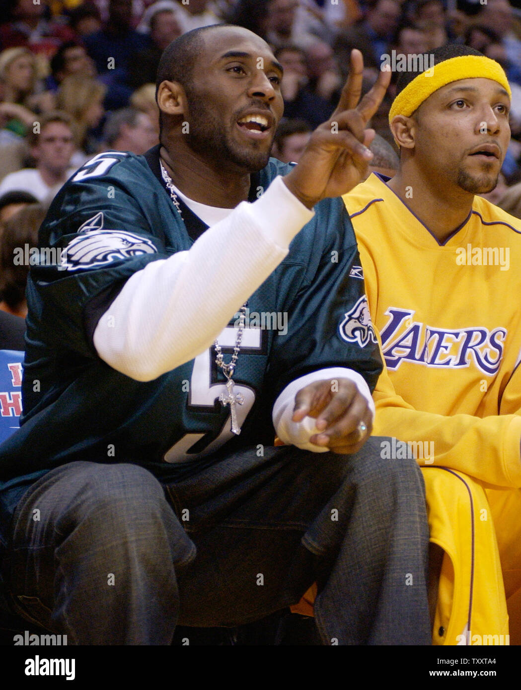 Los Angeles Lakers' Kobe Bryant, wearing a Philadelphia Eagles Donavan McNabb football jersey, reacts to a referee's call during fourth quarter action against the San Antonio Spurs, February 3, 2005, at Staples Center in Los Angeles. Bryant, whose hometown is Philadelphia is sidelined with a severely sprained right ankle and is not expected to return until after the All-Star break at the earliest.  (UPI Photo/Jim Ruymen) Stock Photo