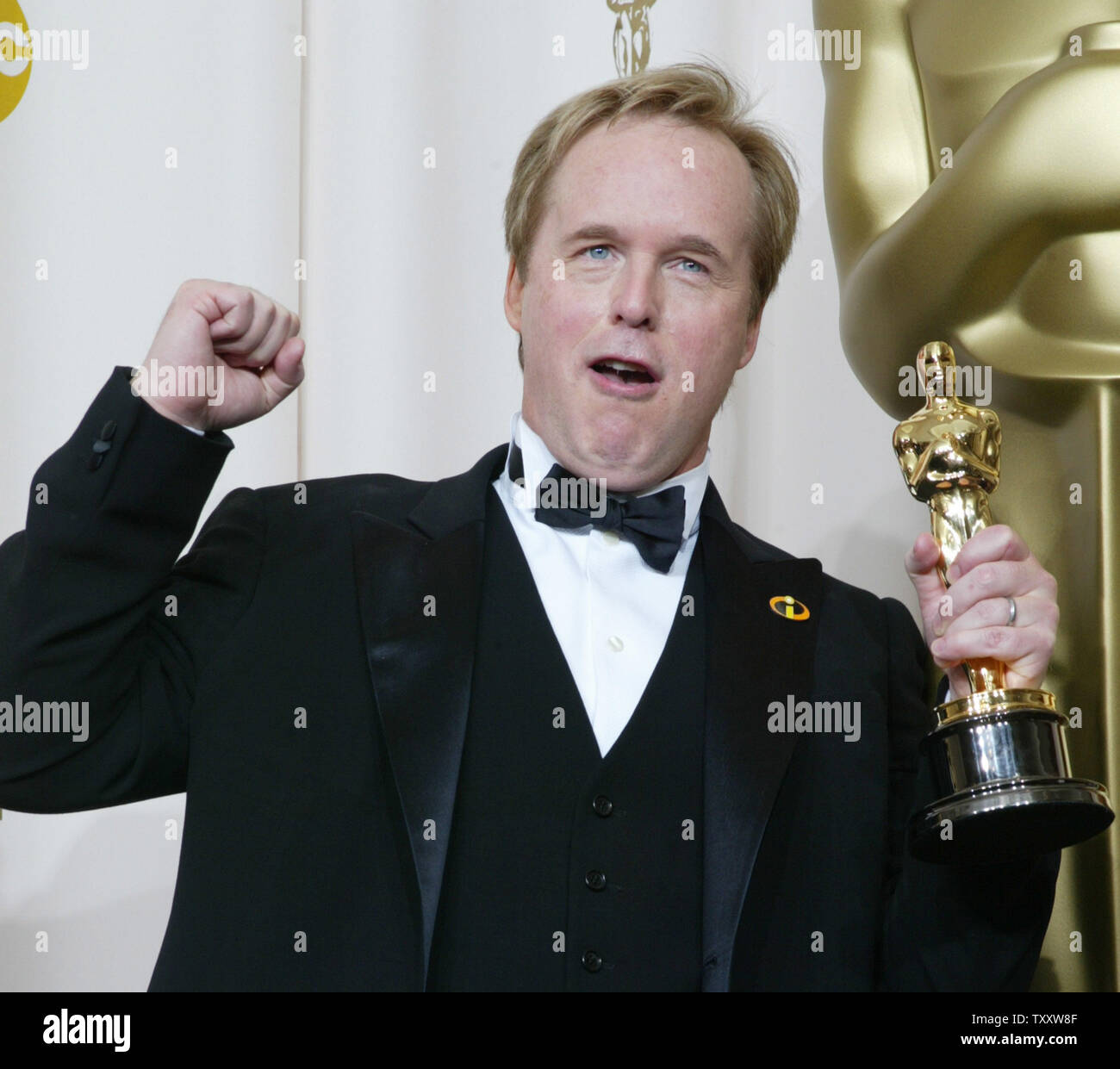 Brad Bird celebrates his Oscar for Best Animated Feature for his film "The Incredibles" at the