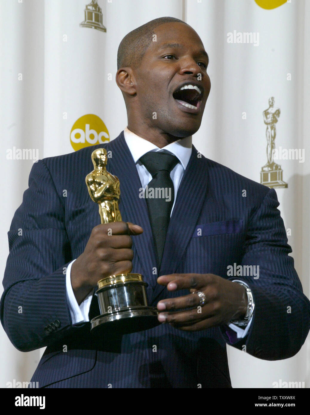 Jamie Foxx celebrates his best actor Oscar for his role in "Ray" at the