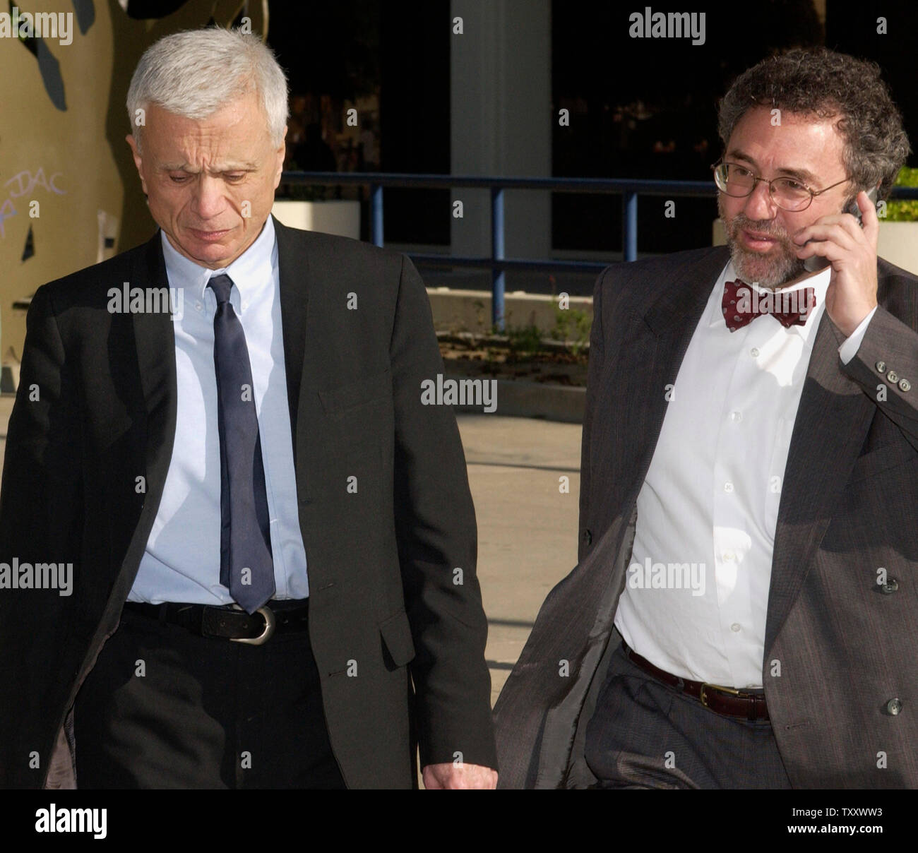 Actor Robert Blake (L) and his attorney M. Gerald Schwartzbach depart the Van Nuys courthouse after attending a court session in his murder trial, in Los Angeles March 15, 2005. Jurors in 'Baretta' star Robert Blake's murder trial continue after more than a week of deliberations without a verdict, increasing speculation they may deadlock over whether the actor shot and killed his wife outside his favorite restaurant.   (UPI Photo/Jim Ruymen) Stock Photo