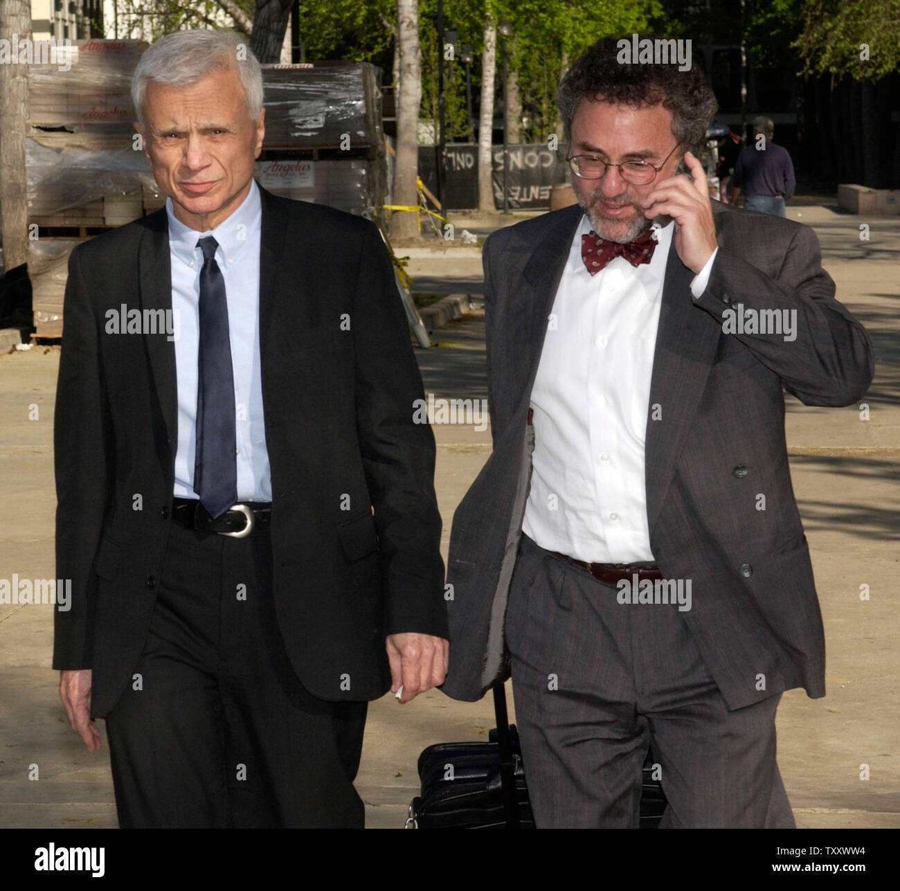 Actor Robert Blake (L) and his attorney M. Gerald Schwartzbach depart the Van Nuys courthouse after attending a court session in his murder trial, in Los Angeles March 15, 2005. Jurors in 'Baretta' star Robert Blake's murder trial continue after more than a week of deliberations without a verdict, increasing speculation they may deadlock over whether the actor shot and killed his wife outside his favorite restaurant.   (UPI Photo/Jim Ruymen) Stock Photo