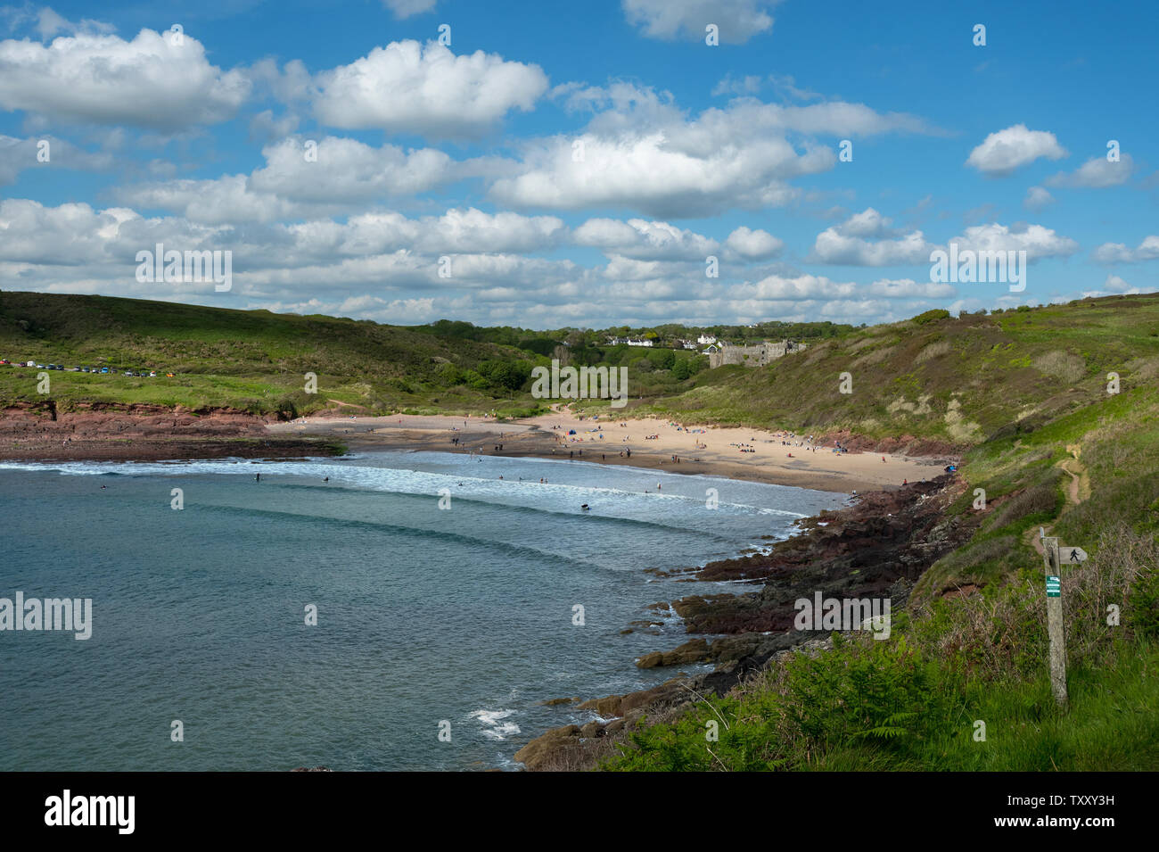 Manorbier Castle and Monarbier Bay with coast path, Pembrokeshire
