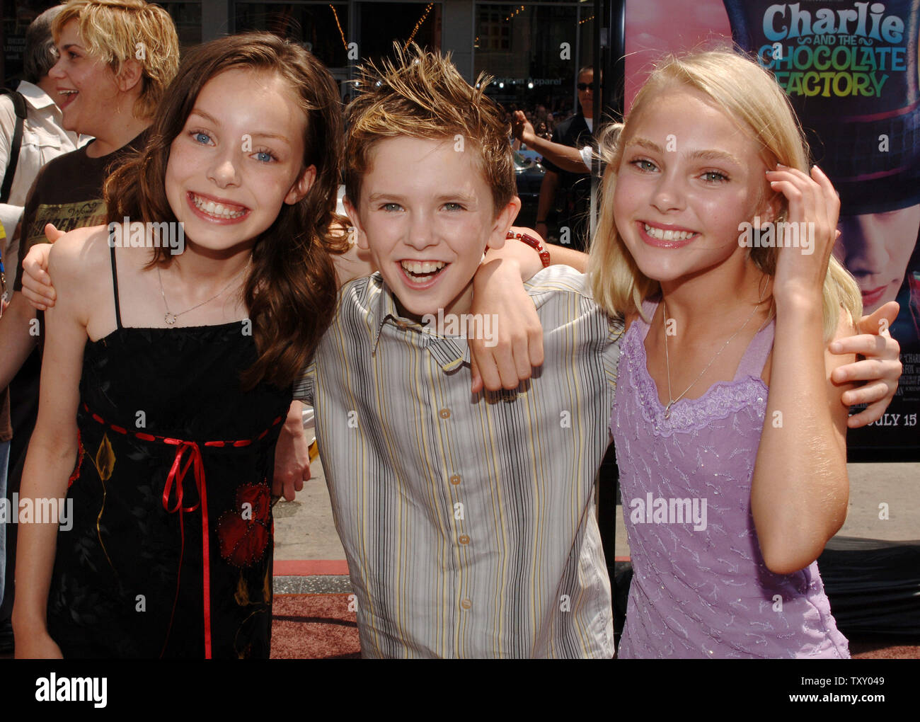 Julia Winter, Freddie Highmore and Annasophia Robb (L-R), cast members in  the new motion picture "Charlie and the Chocolate Factory'," directed by Tim  Burton, arrive for the premiere of the film at