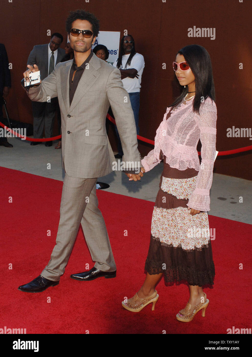 Singer Eric Benet and daughter India pose as they arrive at the tenth annual Soul Train Lady of Soul Awards in Pasadena, California September 7, 2005. The syndicated television awards show honors the accomplishments of female recording artists in the fields of Soul, R&B, Hip-Hop, Rap and Gospel music. (UPI Photo/Jim Ruymen) Stock Photo