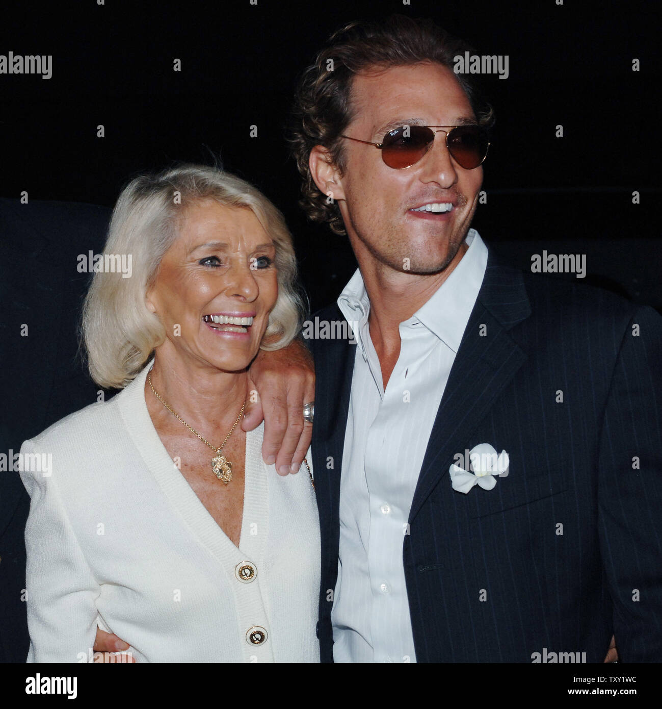 Actor Matthew McConaughey, one of the stars of the new motion picture drama 'Two for the Money' and wearing a magnolia in his lapel in support of hurricane victims, arrives with his mother Kay at the film's premiere in Beverly Hills September 26, 2005. The film also stars Al Pacino, Rene Russo and Jaime King and is about a former college football star who suffers a career-ending injury and aligns himself with one of the most renowned bookies in the sports gambling business. The movie opens October 7 in the United States.   (UPI Photo/Jim Ruymen) Stock Photo