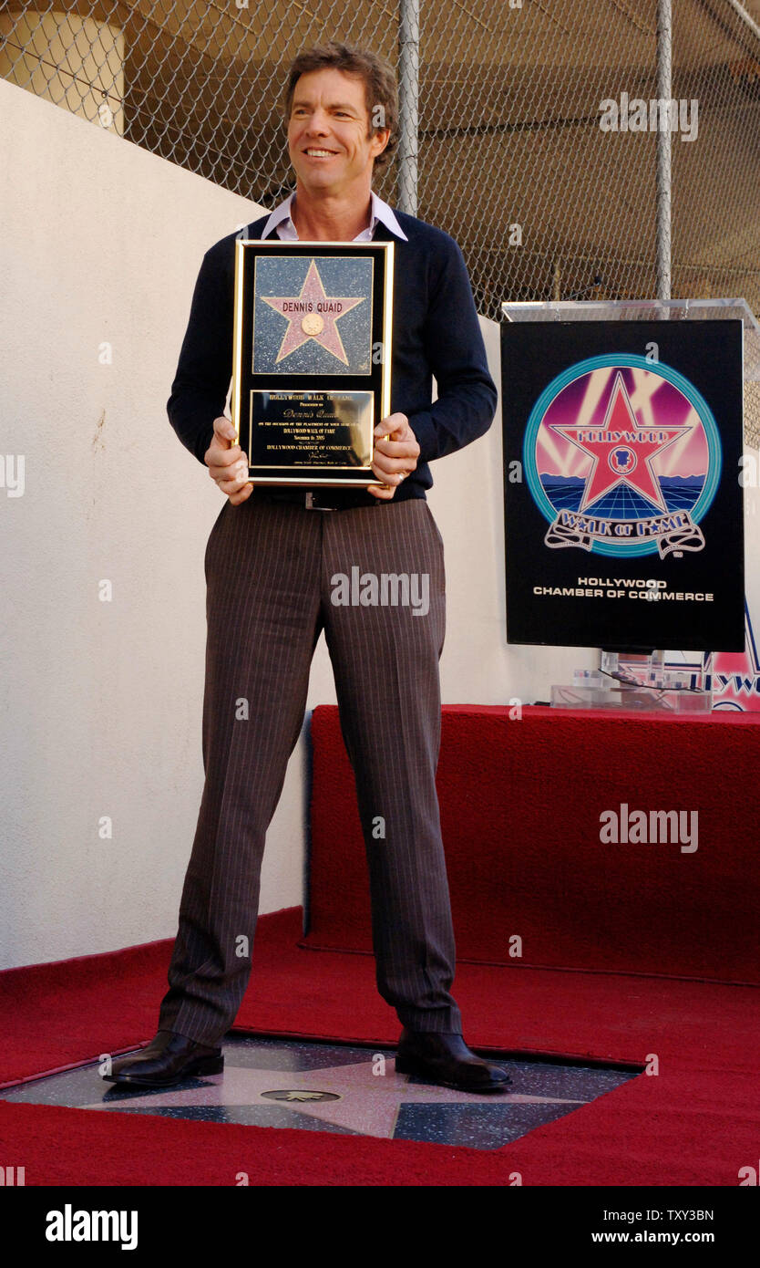 Actor Dennis Quaid, star of the upcoming holiday family comedy 'Yours, Mine and Ours' holds a replica plaque during an unveiling ceremony honoring Quaid with the 2,295th star on the Hollywood Walk of Fame in Los Angeles, California  November 16, 2005.  (UPI Photo/Jim Ruymen) Stock Photo