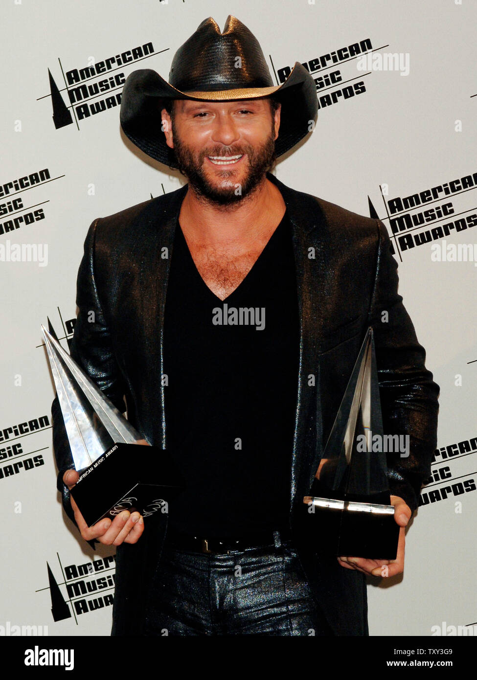 Singer Tim Mcgraw Holds His Awards For Country Favorite Male