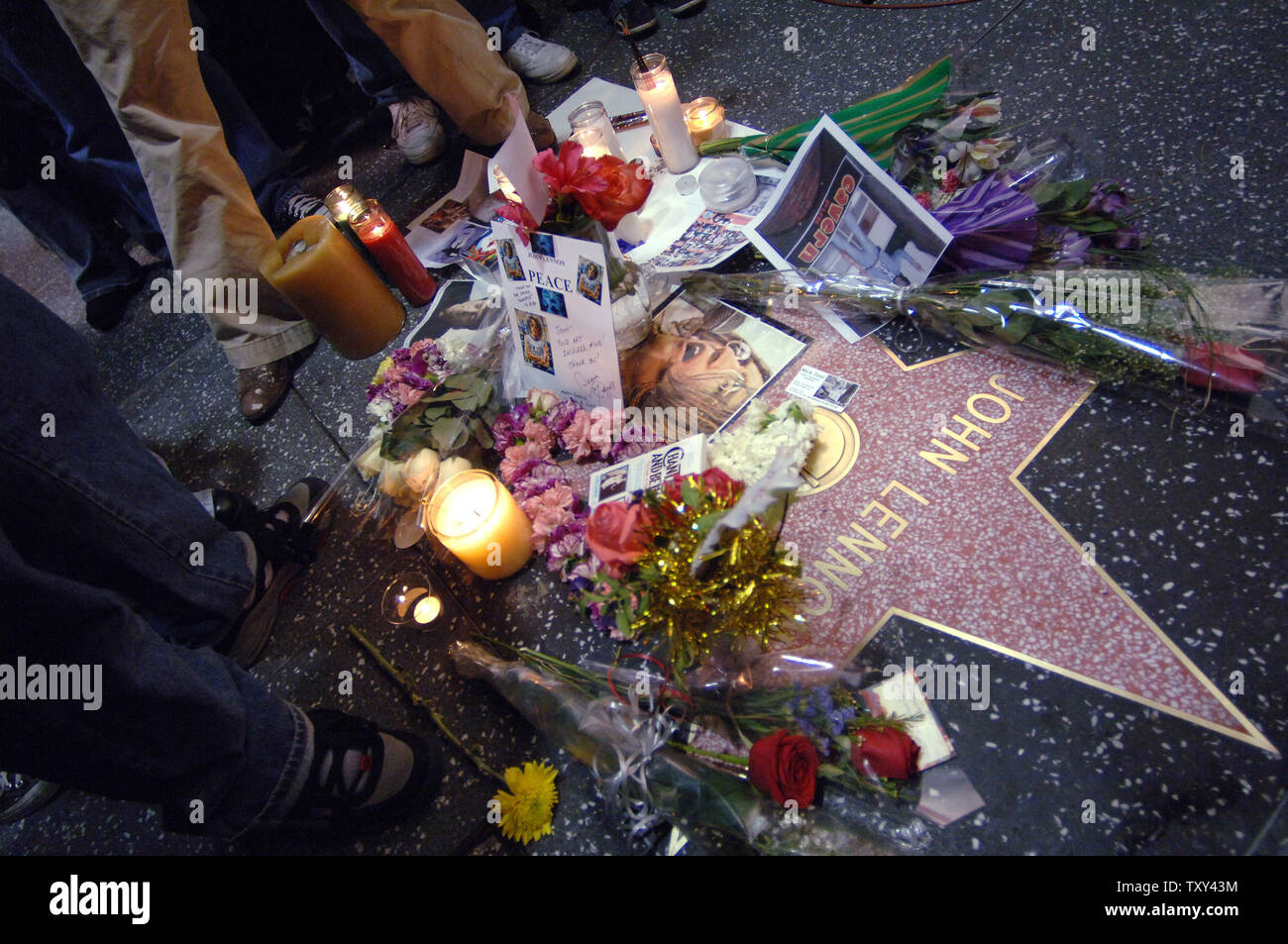 Fans attend a candle light vigil in honor of the 25th anniversary of