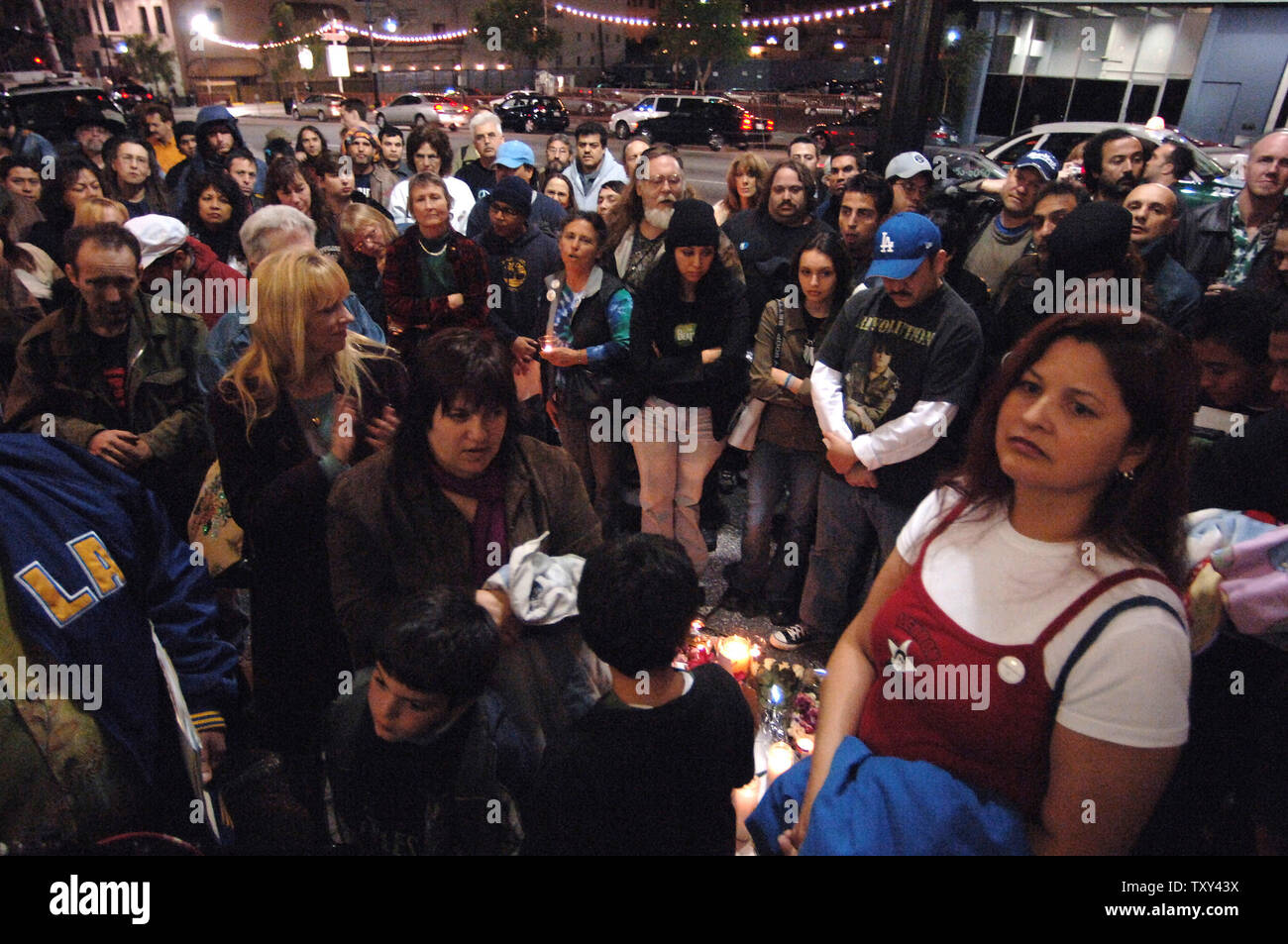 Fans attend a candle light vigil in honor of the 25th anniversary of