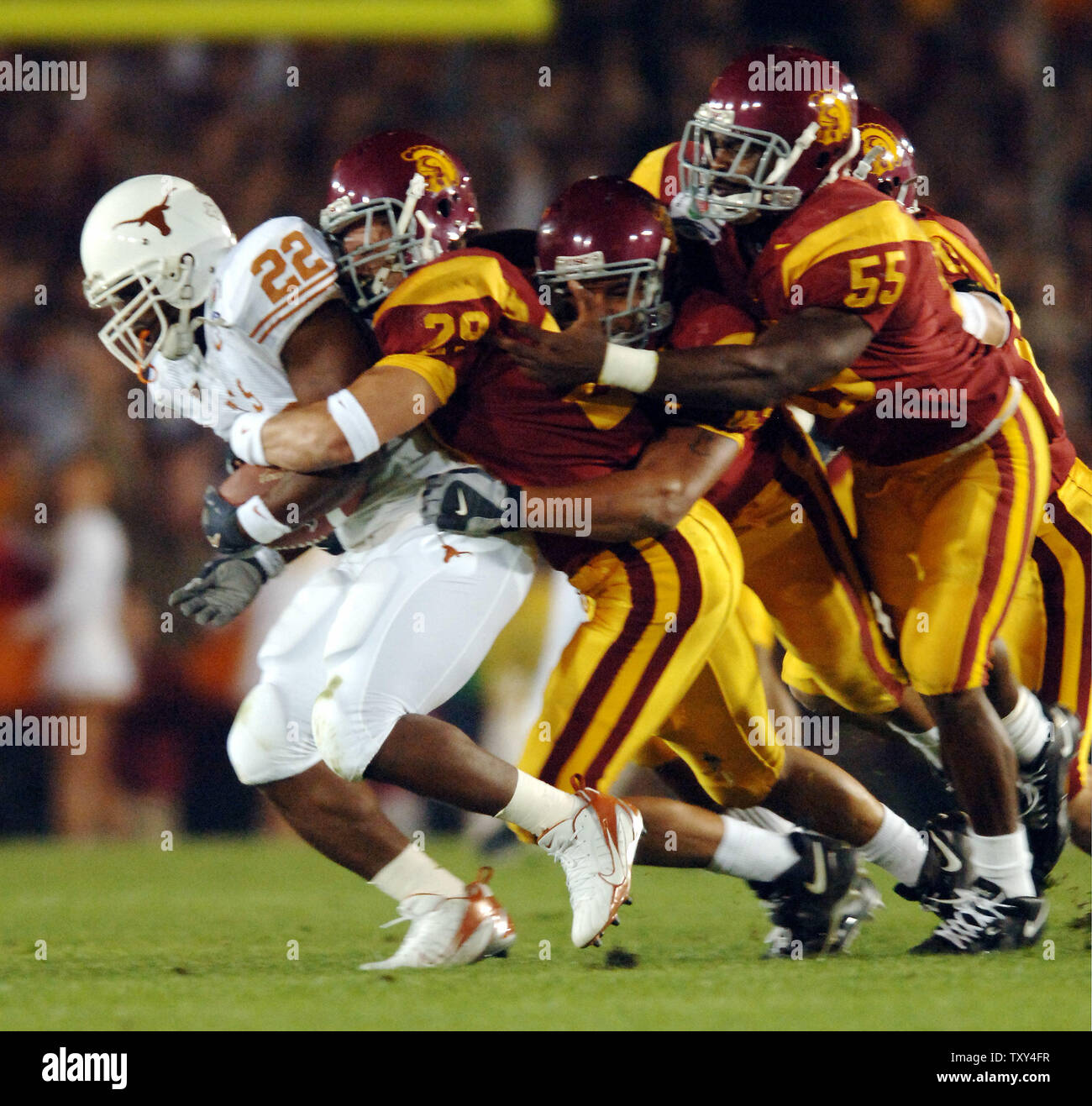 University of Texas running back Selvin Young (#22) is thrown for a loss on  the fourth and one by University of Southern California defense during  first quarter action of the 92nd Rose