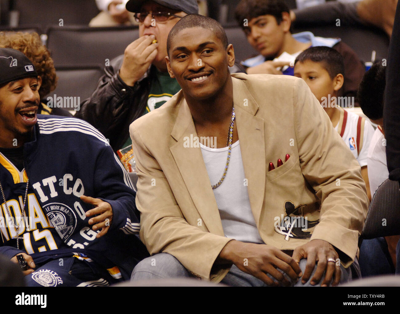 Indiana Pacers' Ron Artest (R) watches the Los Angeles Lakers' NBA basketball game against the Cleveland Cavaliers in Los Angeles on January 12, 2006.  Artest, the 2003-04 NBA defensive player of the year, was averaging 19.4 points when he voiced his desire to be traded last month. He later recanted that statement, but team president Larry Bird and Walsh have said they are no longer interested in having him play for Indiana. Artest hasn't played in a game since Dec. 6. (UPI Photo/Jim Ruymen) Stock Photo