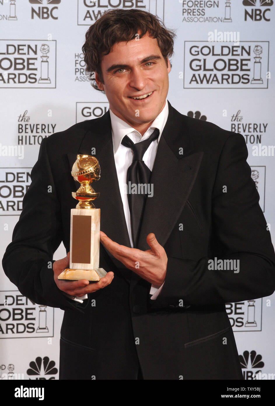 Joaquin Phoenix holds his award for best actor in "Walk the Line" at the  63rd annual Golden Globe Awards in Beverly Hills, CA on January 16, 2006.  (UPI Photo/Jim Ruymen Stock Photo -