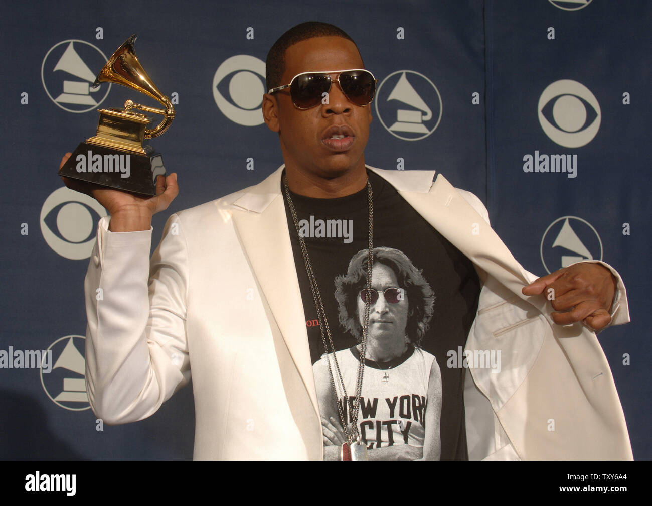 Jay-Z holds his Grammy for Best Rap/Sung Collaboration at the 48th 