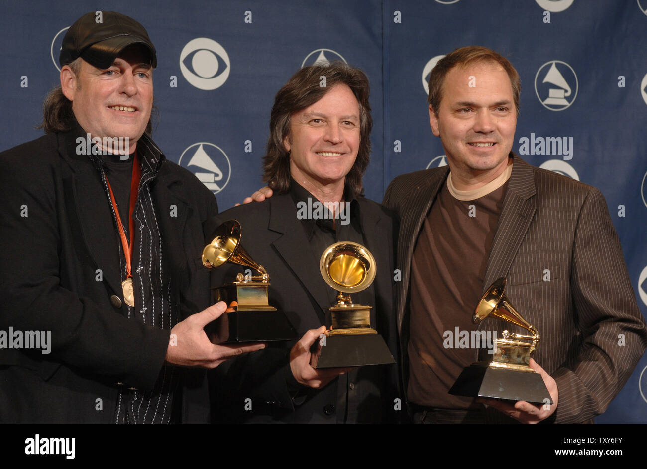 Bobby Boyd (L), Jeff Hanna, and Marcus Hummon hold their Grammys for Best Country Song awarded for 'Bless The Broken Road' at the 48th Annual Grammy Awards at the Staples Center in Los Angeles on February 8, 2006.  (UPI Photo/Phil McCarten) Stock Photo