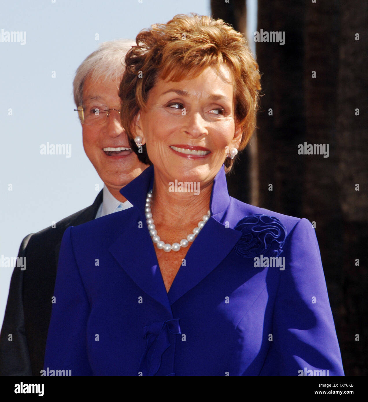 Judge Judy Sheindlin, the star of television's number one syndicated courtroom series that bears her name, reacts to fans during a ceremony honoring her with the 2,304th star on the Hollywood Walk of Fame in Los Angeles, California February 14, 2006. Looking on at left, rear is her husband Judge Jerry Sheindlin. (UPI Photo/Jim Ruymen) Stock Photo