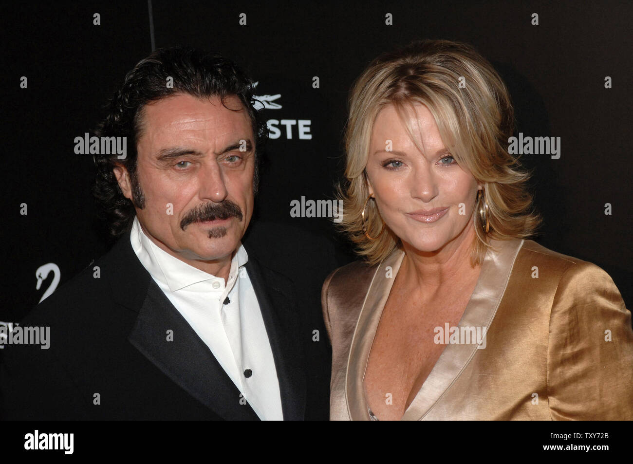 Actor Ian McShane (L) and wife Gwen McShane arrive for the 8th annual Costume Designers Guild Awards held at the Beverly Hilton Hotel in Beverly Hills, California on February 25, 2006 . (UPI Photo/ Phil McCarten) Stock Photo