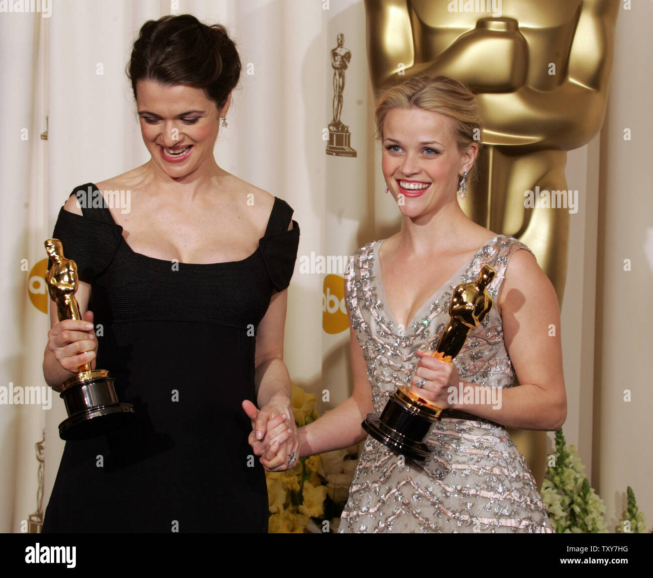 Reese Witherspoon (R) poses with her best actress Oscar for 'Walk the Line' along with Rachel Weisz and her Oscar for best supporting actress for 'Constant Gardener' at the 78th Annual Academy Awards at the Kodak Theatre in Hollywood, Ca., on March 5, 2006.   (UPI Photo/Gary C. Caskey) Stock Photo