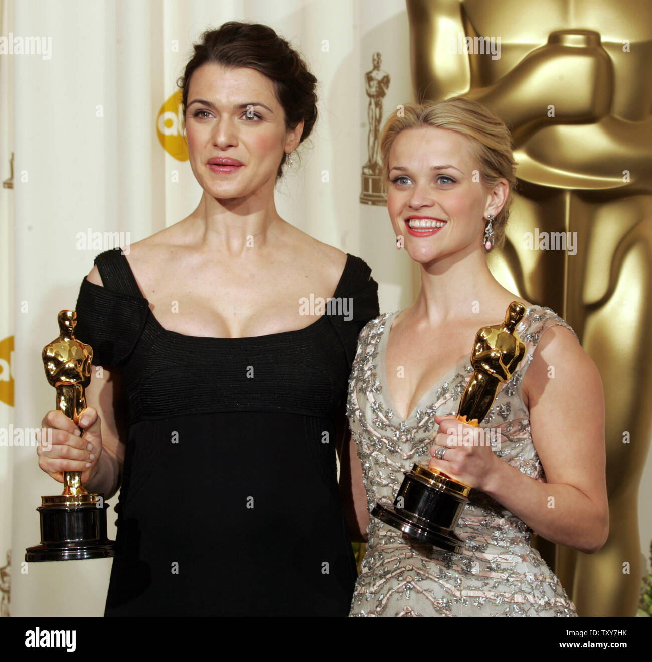 Reese Witherspoon (R) poses with her best actress Oscar for 'Walk the Line' along with Rachel Weisz and her Oscar for best supporting actress for 'Constant Gardener' at the 78th Annual Academy Awards at the Kodak Theatre in Hollywood, Ca., on March 5, 2006.   (UPI Photo/Gary C. Caskey) Stock Photo