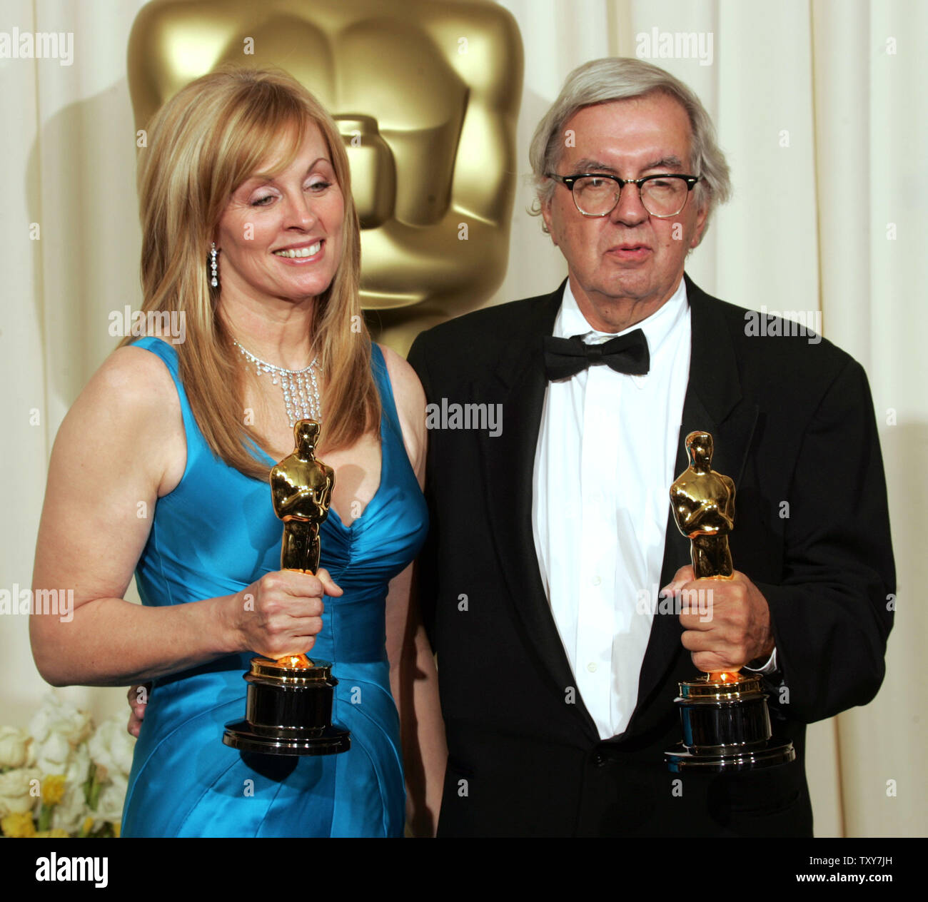 Writers Larry McMurtry (R) and Diana Ossana pose with their Oscars for best adapted screenplay for 'Brokeback Mountain' at the 78th Annual Academy Awards at the Kodak Theatre in Hollywood, Ca., on March 5, 2006.   (UPI Photo/Gary C. Caskey) Stock Photo