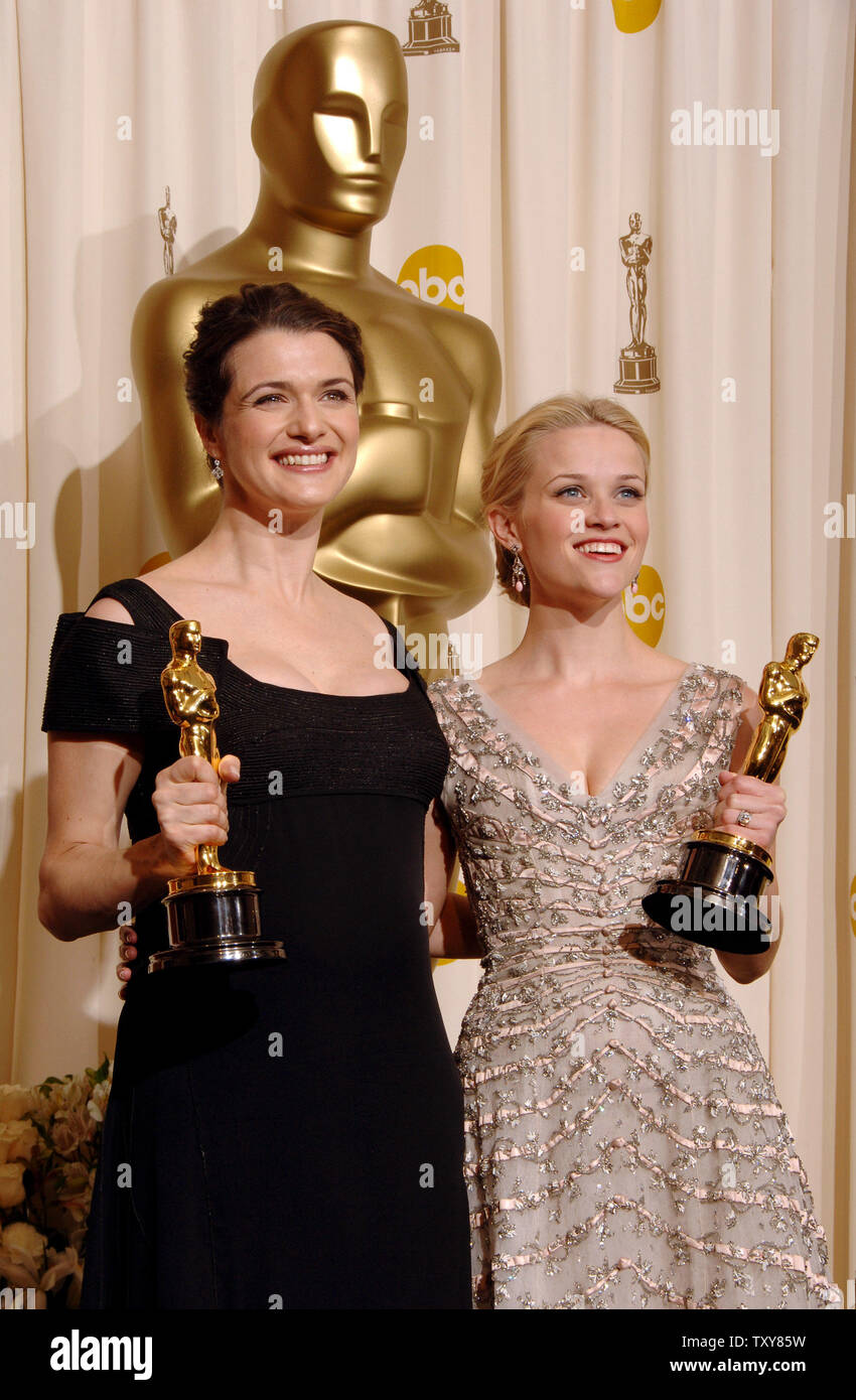 Reese Witherspoon (R) appears backstage with the Oscar she won for best ...