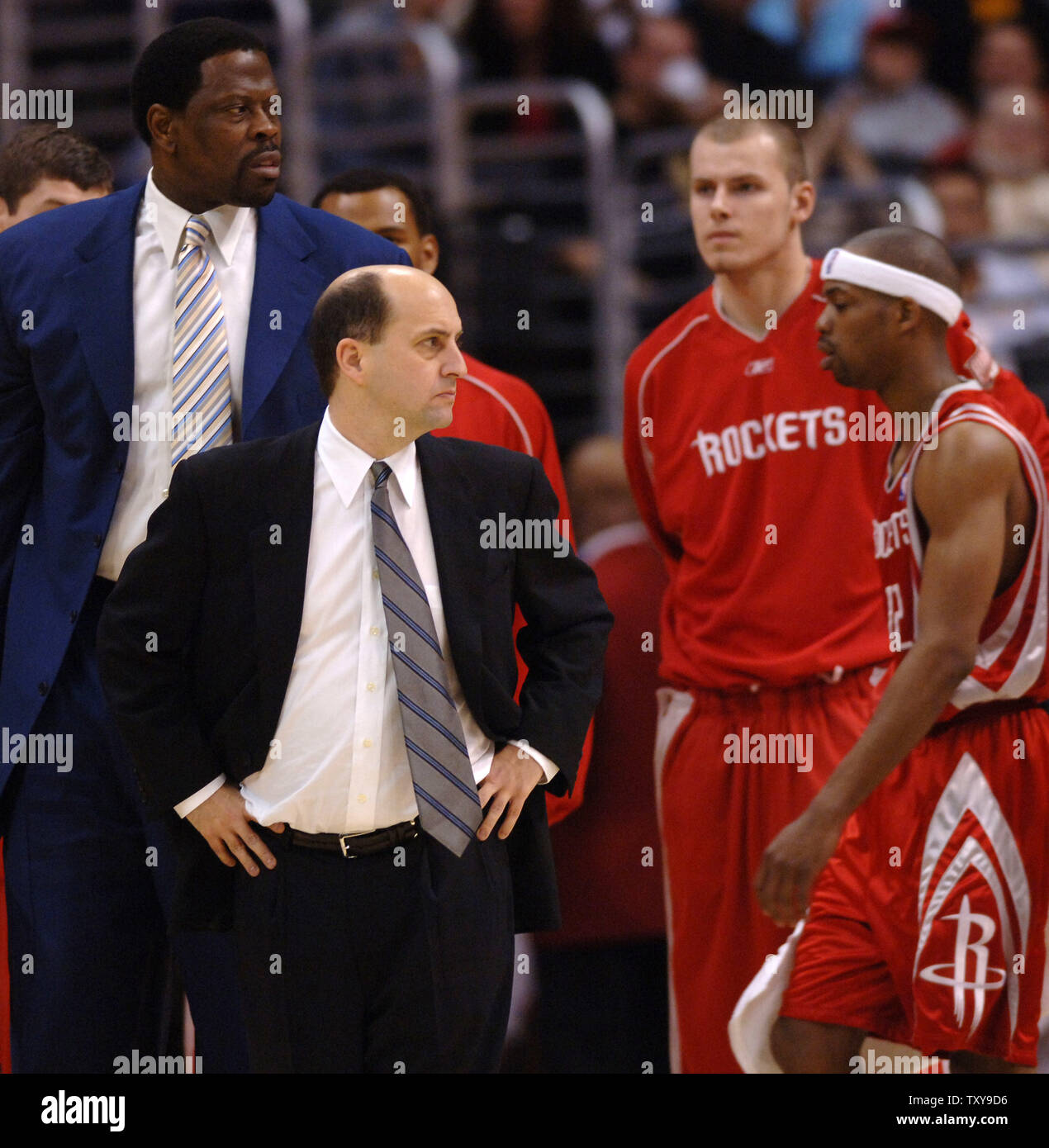 Houston Rockets' head coach Jeff Van Gundy, foreground, stares down the referee during a time out in the fourth quarter of their NBA basketball game against the Los Angeles Lakers at Staples Center in Los Angeles, California on April 2, 2006. The Lakers defeated the Rockets 104-88.  Looking on is assistant coach Patrick Ewing , rear, left. (UPI Photo/Jim Ruymen) Stock Photo