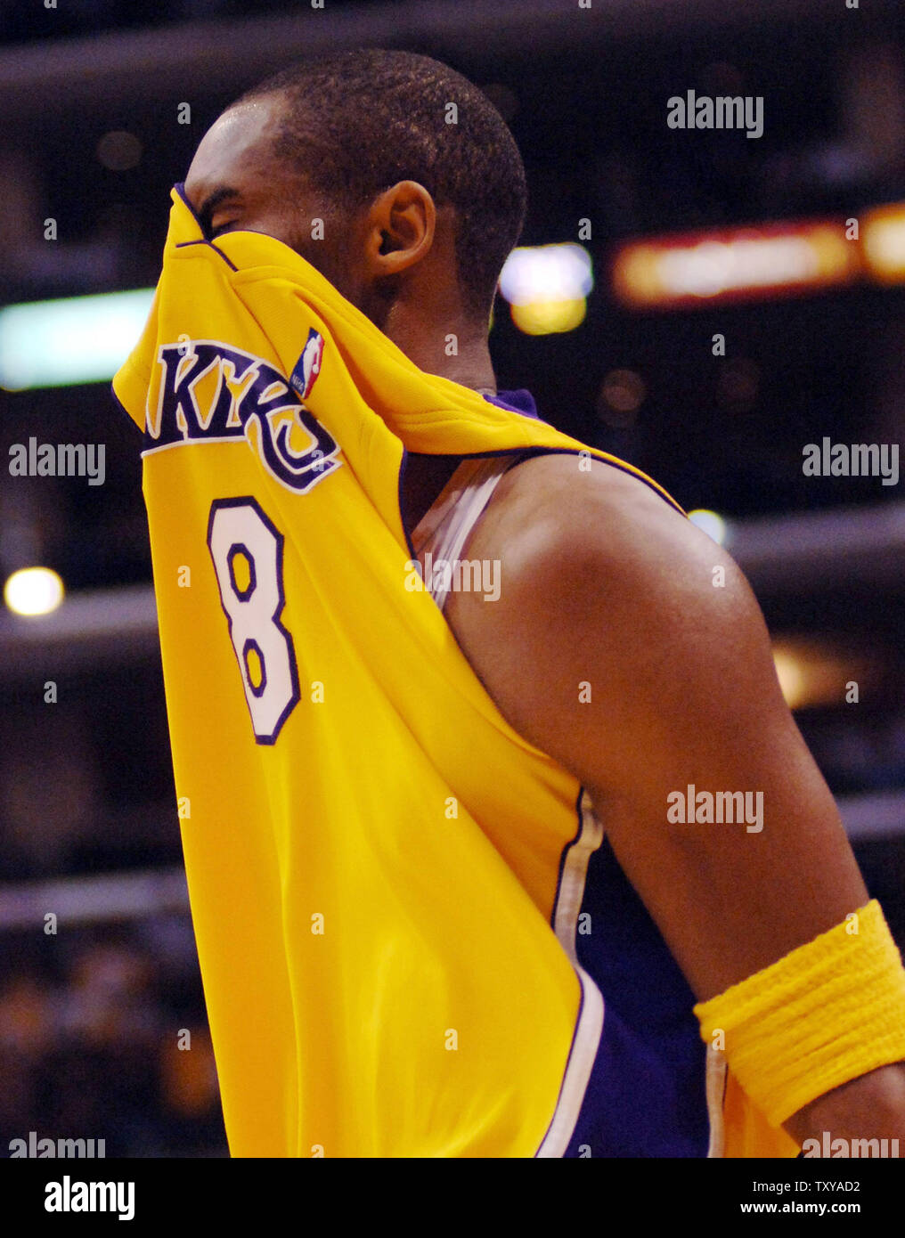 Los Angeles Lakers' Kobe Bryant covers his face with his jersey ...
