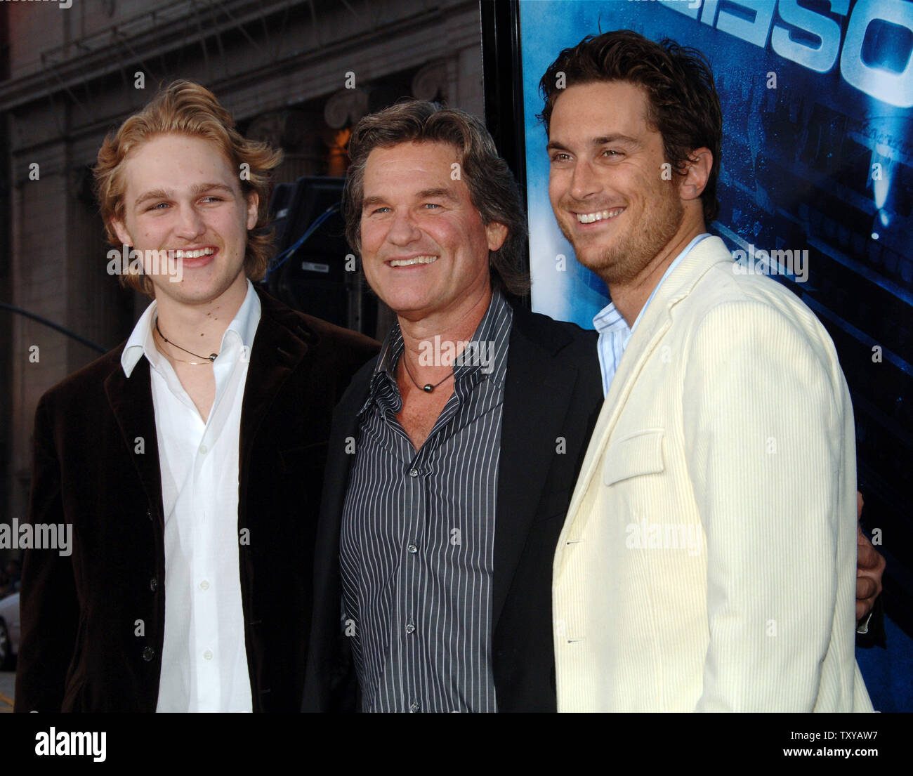 Cast member Kurt Russell (C) arrives accompanied by his son Wyatt (L) and  his stepson Oliver Hudson for the premiere of the motion picture drama  "Poseidon" at Grauman's Chinese Theatre in the