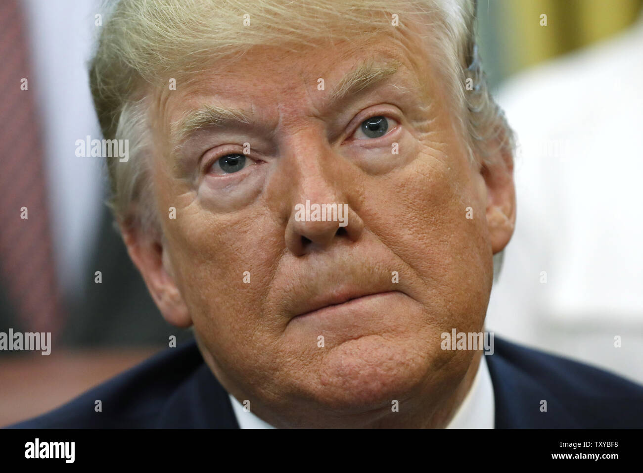 Washington, District of Columbia, USA. 25th June, 2019. US President Donald Trump talks to the media after signing an Executive Order Establishing a White House Council on Eliminating Regulatory Barriers to Affordable Housing in the Oval Office at the White House in Washington, DC, on June 25, 2019. Credit: Yuri Gripas/Pool via CNP Credit: Yuri Gripas/CNP/ZUMA Wire/Alamy Live News Stock Photo
