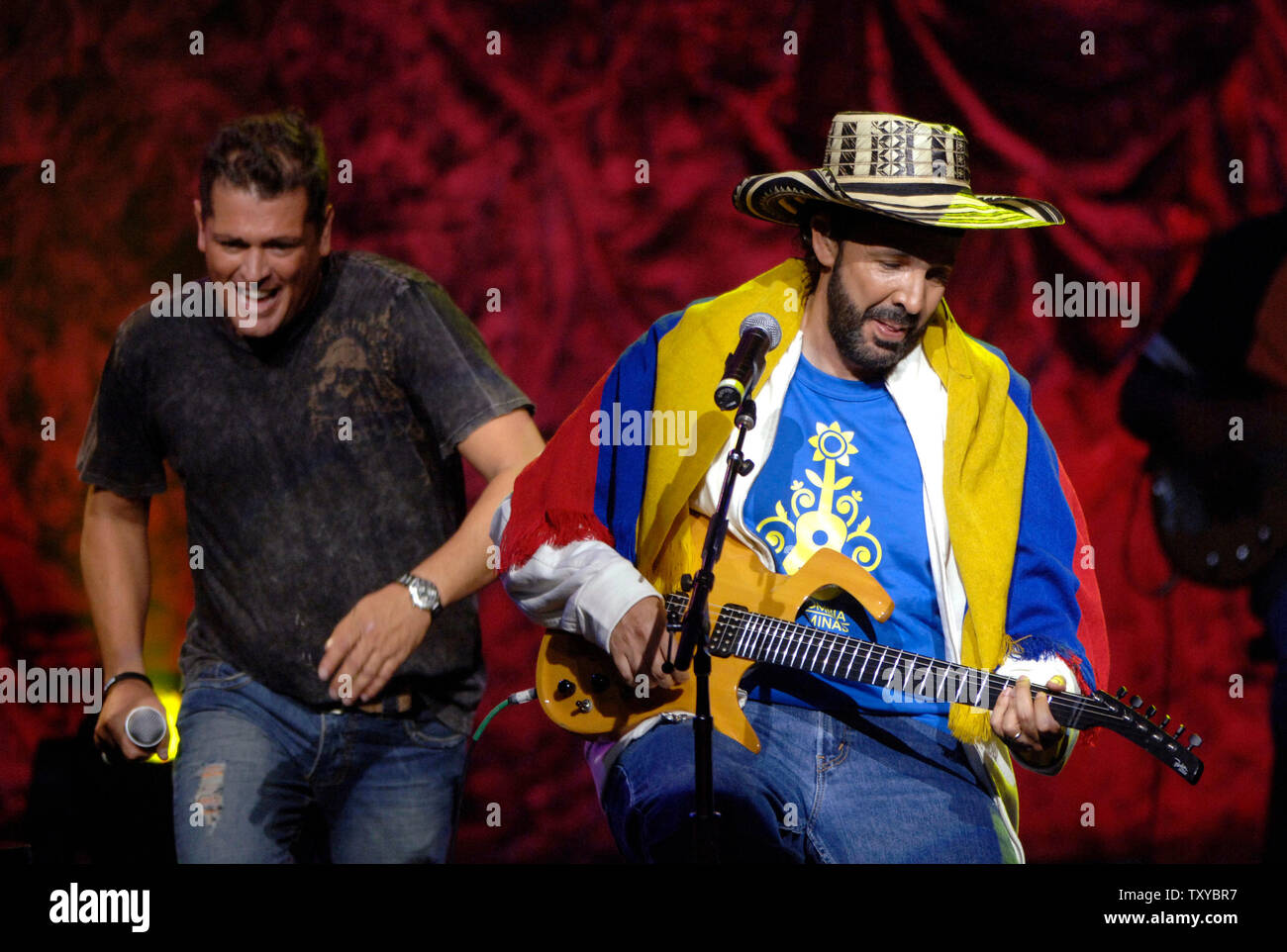 Carlos Vives and Juan Luis Guerra perform at the 'Colombia Sin Minas' concert to benefit children victimized by antipersonnel mines in Colombia held at the Gibson Amphitheatre in Los Angeles, California on May 24, 2006 . (UPI Photo/ Phil McCarten) Stock Photo