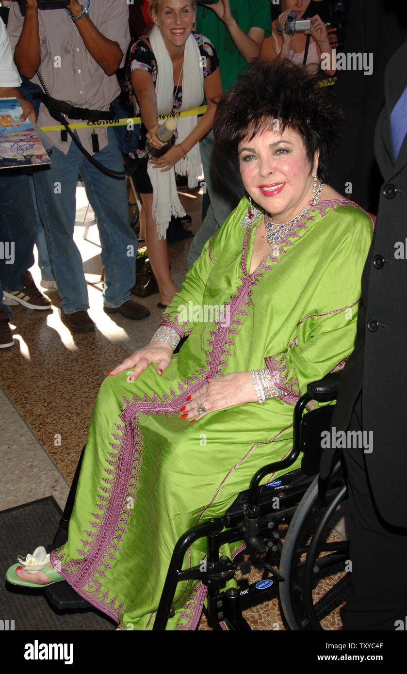 Academy Award Winning Actress And Aids Activist Elizabeth Taylor Exits The Cnn Studios After An Appearance On Larry King Live In Los Angeles California On May 30 2006 Taylor Is Pictured Wearing