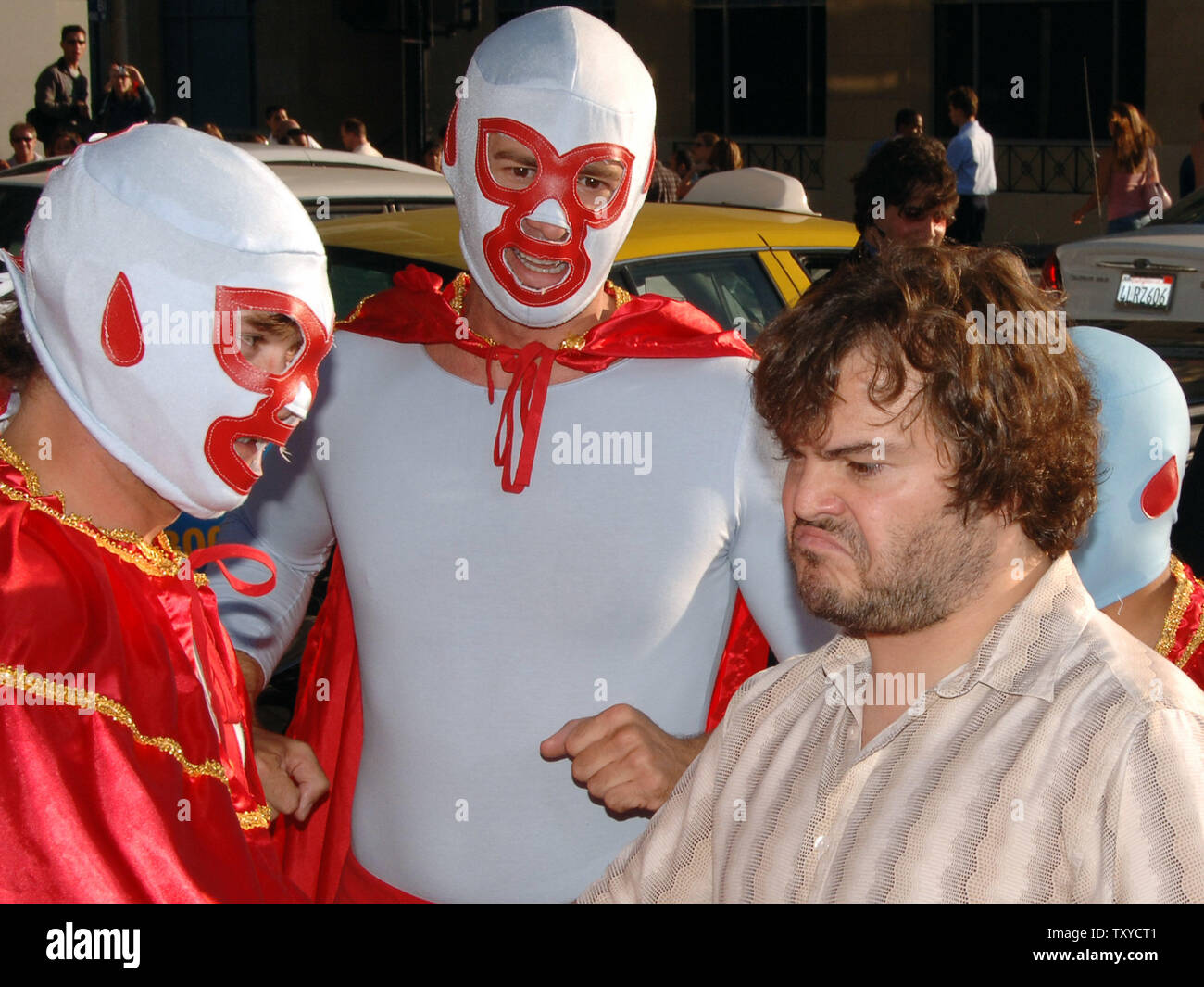 Cast Member Jack Black Is Trailed By Actors In Mexican Lucha Libre Wrestling Costumes During The World Premiere Of The Motion Picture Comedy Nacho Libre At Grauman S Chinese Theatre In The Hollywood
