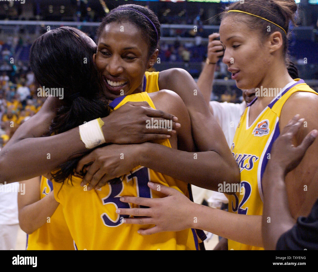 Los Angeles Sparks' Lisa Leslie hugs teammate Jessica Moore after defeating  the Seattle Storm in Game 3 of their WNBA first-round playoff series in Los  Angeles on August 22, 2006. The Sparks, image size:1300x1110