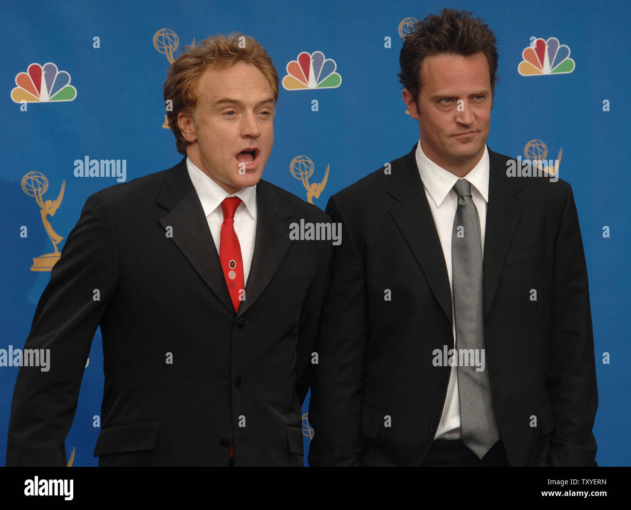 Bradley Whitford (L) and Matthew Perry appear backstage at the 58th