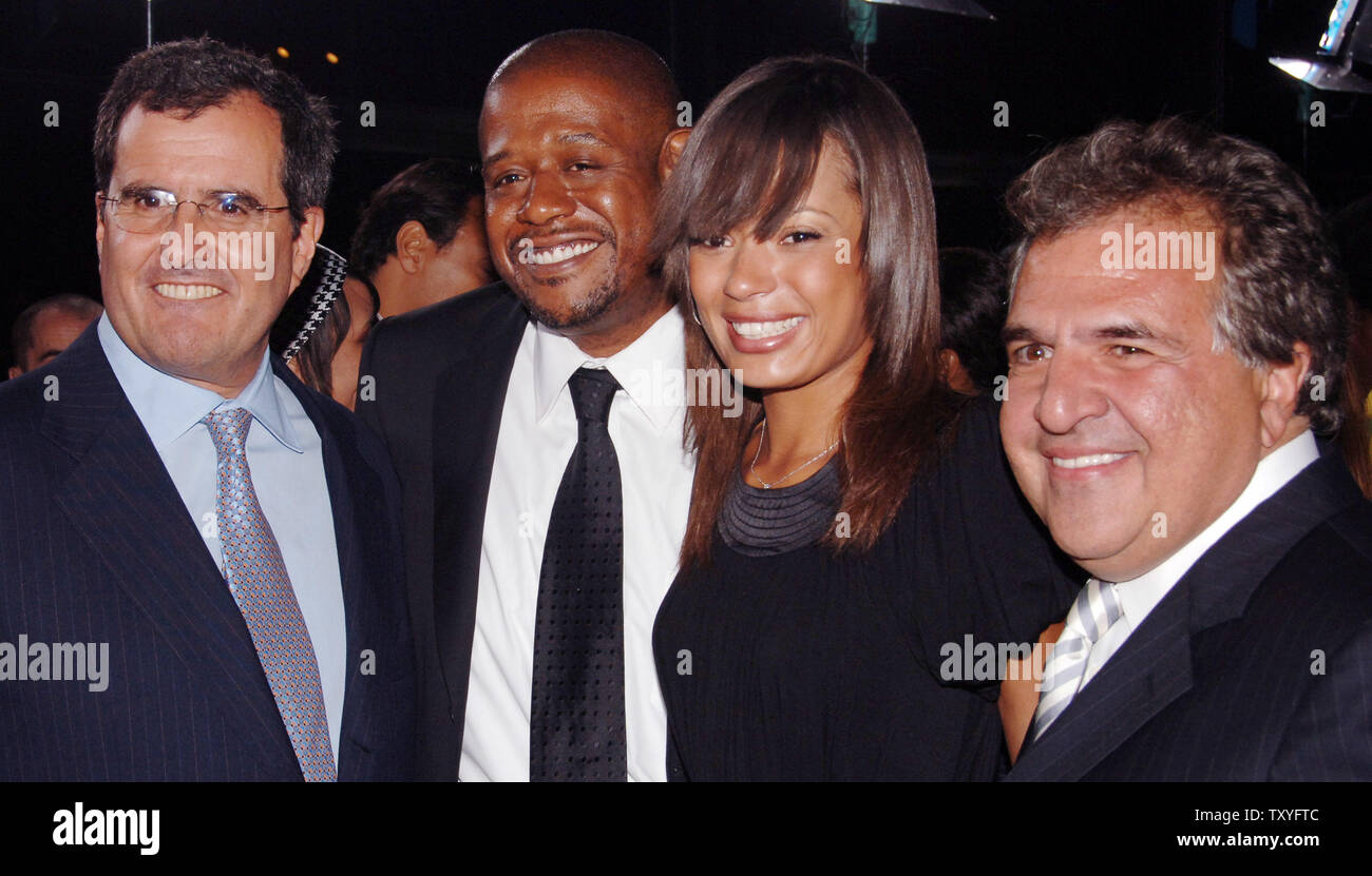 Forest Whitaker (2nd-L), who portrays Ugandan dictator Idi Amin in the historical drama motion picture 'The Last King of Scotland,' poses with his wife Keisha and Peter Chernin (L), CEO of News Corporation and Jim Gianopulos (R), Chairman Fox Films Entertainment during the premiere of the film at the Academy of Motion Picture Arts & Sciences in Beverly Hills, California on September 21, 2006. The movie is based on the events of the brutal dictator's regime as seen by his personal physician during the 1970s. (UPI Photo/Jim Ruymen) Stock Photo