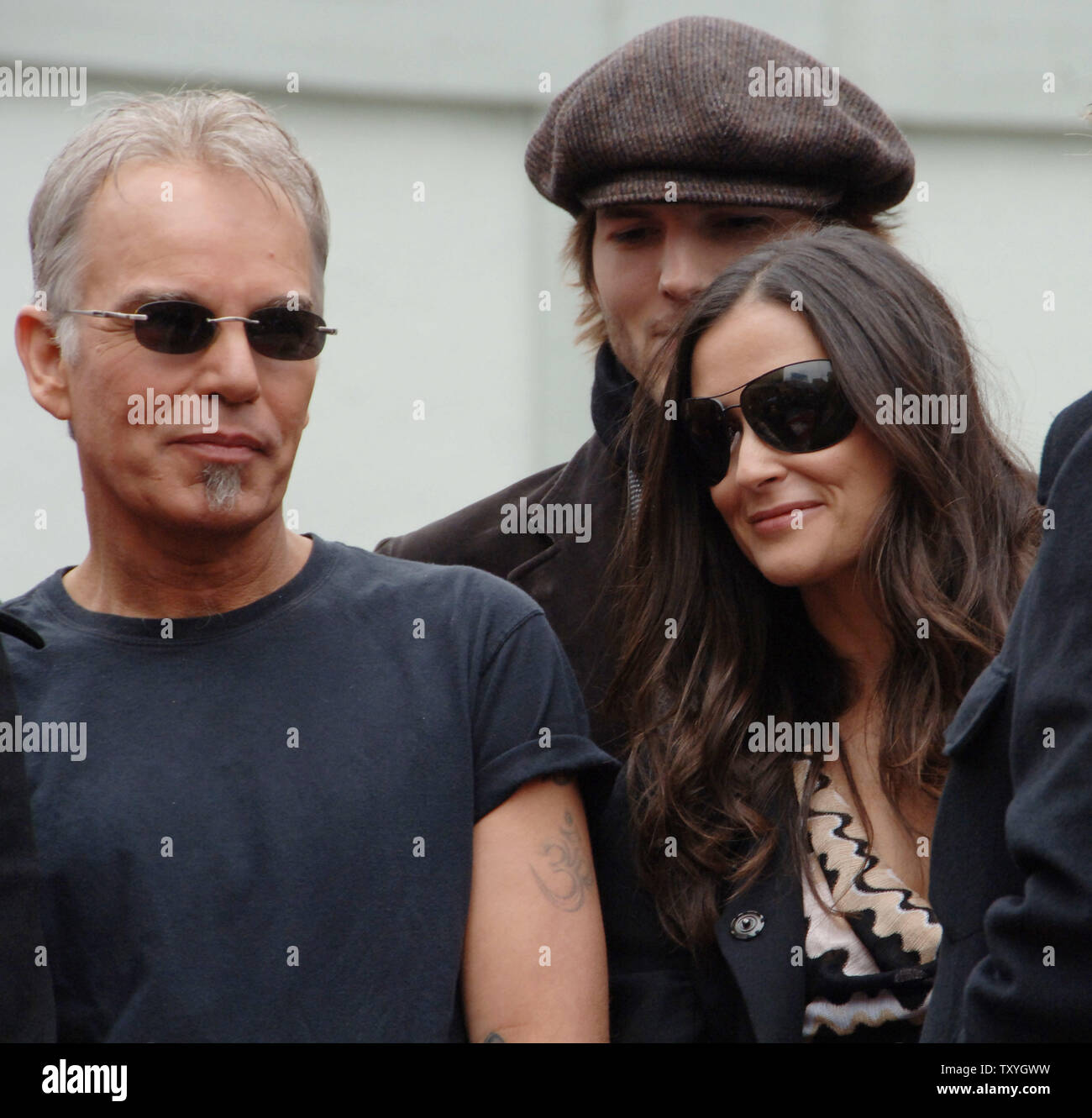 Actress Demi Moore (R), her husband actor Ashton Kutcher (C) and actor Billy Bob Thorton look on as Moore's ex-husband Bruce Willis receives a star on the Hollywood Walk of Fame in Los Angeles, California on October 16, 2006.  (UPI Photo/Jim Ruymen) Stock Photo