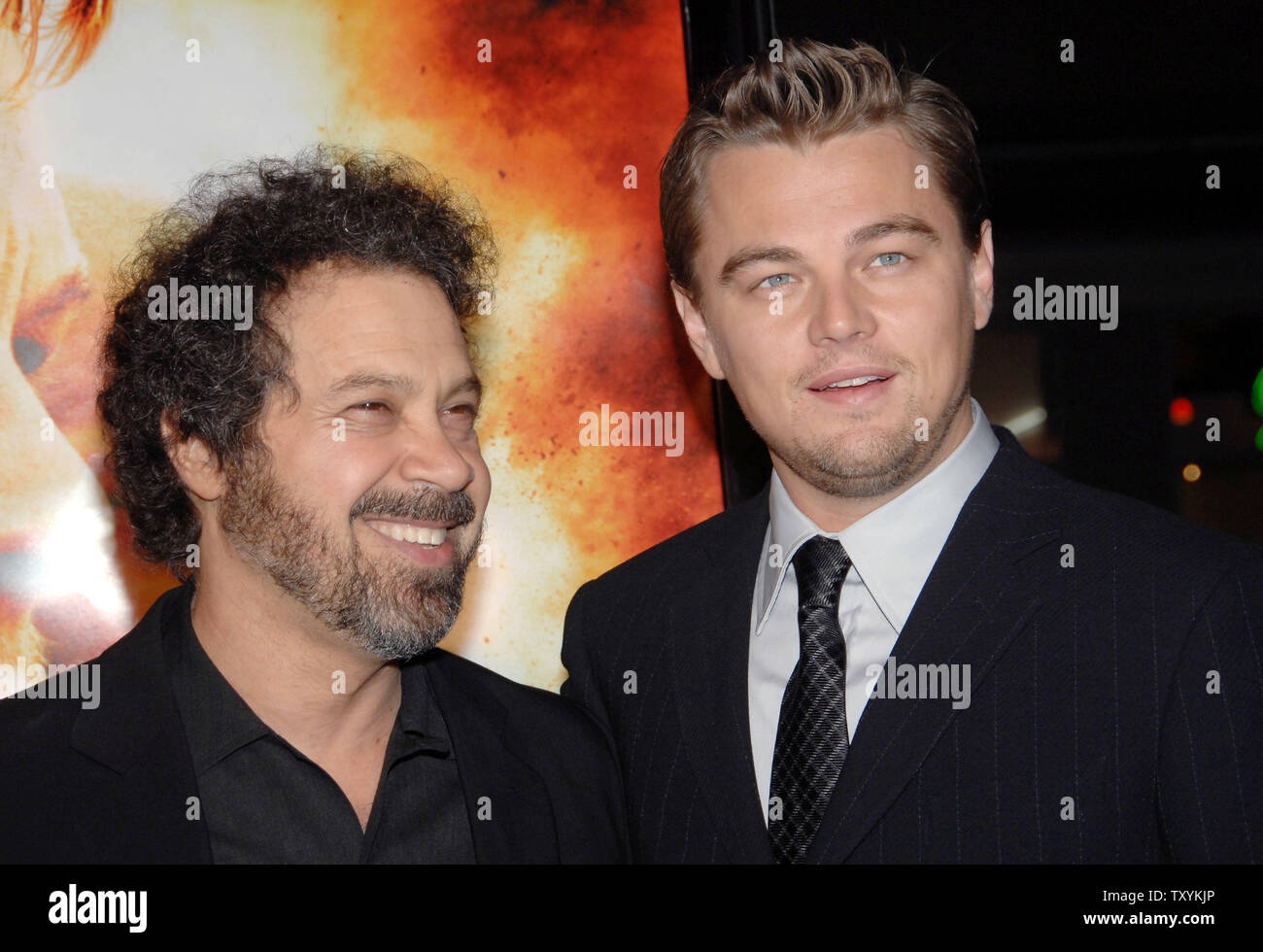 Actor Leonardo DiCaprio (R), star of the new motion picture drama 'Blood Diamond', and director Edward Zwick share a moment during the premiere of the film at Grauman's Chinese Theatre in the Hollywood section of Los Angeles on December 6, 2006. The film, set in Sierra Leone is about a quest to recover a rare diamond. (UPI Photo/Jim Ruymen) Stock Photo