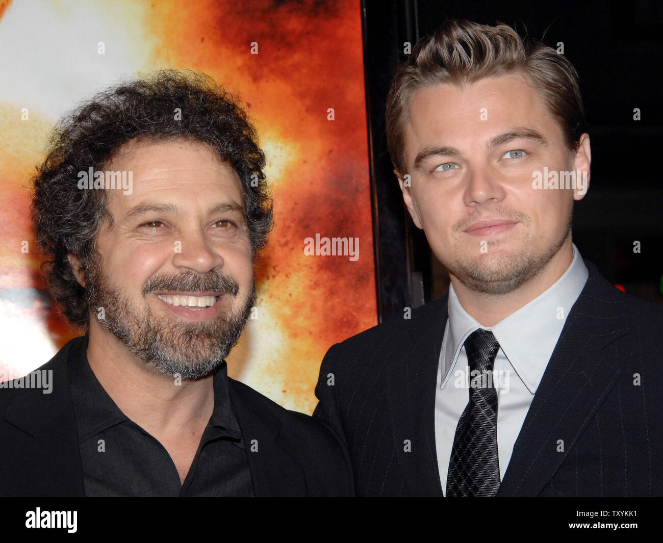 Actor Leonardo DiCaprio (R), star of the new motion picture drama 'Blood Diamond', and director Edward Zwick share a moment during the premiere of the film at Grauman's Chinese Theatre in the Hollywood section of Los Angeles on December 6, 2006. The film, set in Sierra Leone is about a quest to recover a rare diamond. (UPI Photo/Jim Ruymen) Stock Photo