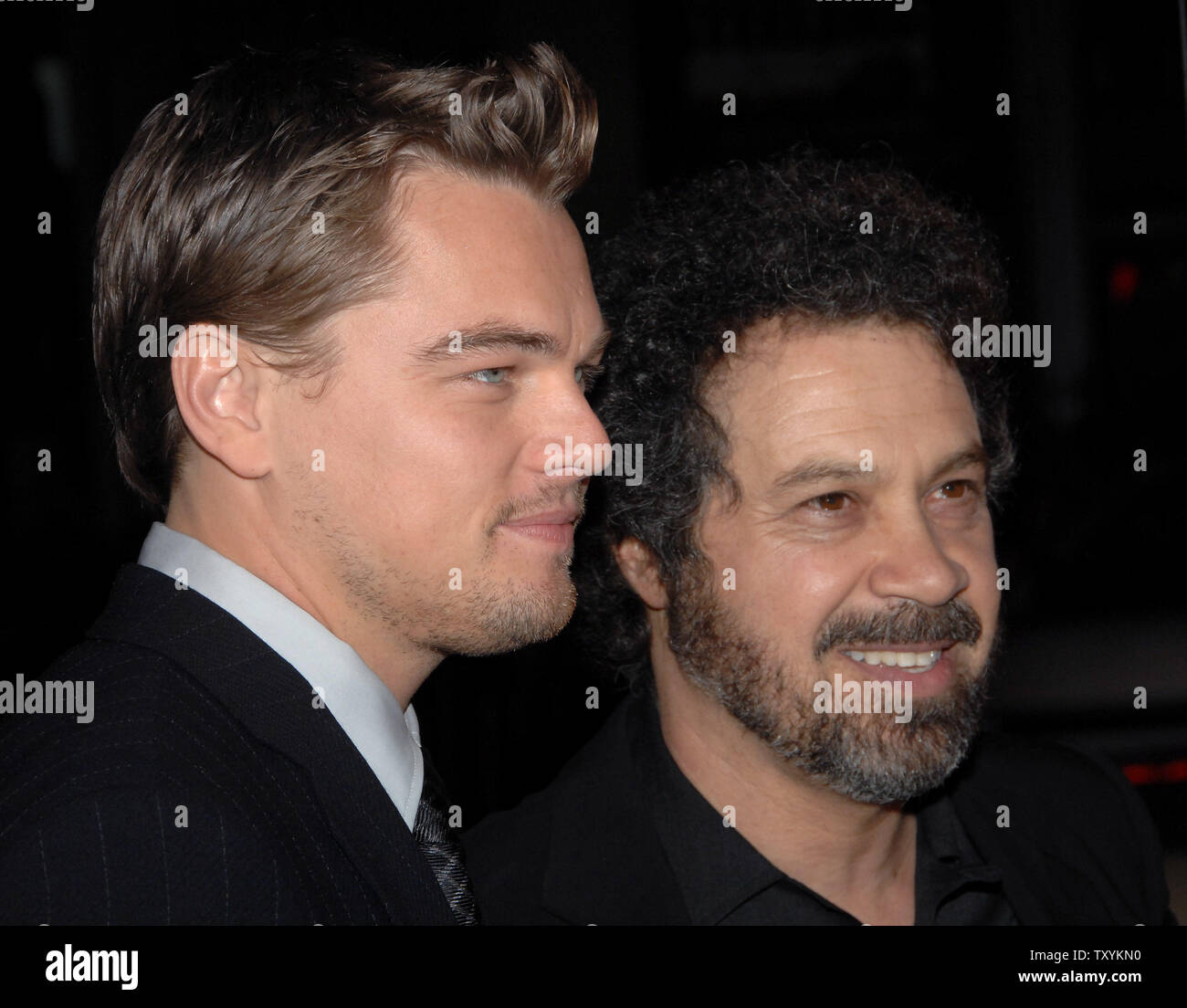Actor Leonardo DiCaprio (L), star of the new motion picture drama 'Blood Diamond', and director Edward Zwick share a moment during the premiere of the film at Grauman's Chinese Theatre in the Hollywood section of Los Angeles on December 6, 2006. The film, set in Sierra Leone is about a quest to recover a rare diamond. (UPI Photo/Jim Ruymen) Stock Photo