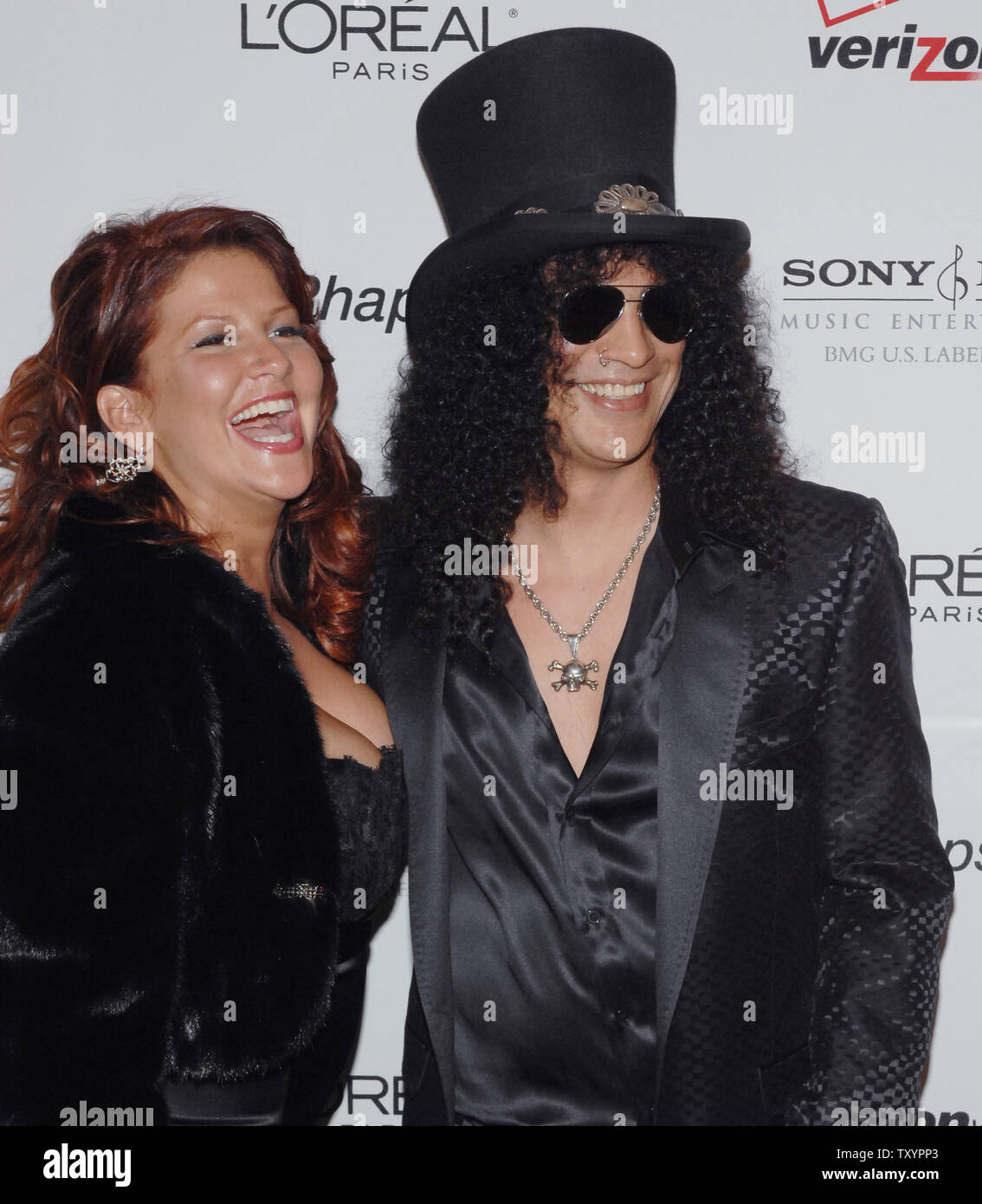 Slash and his wife Peria arrive for the Clive Davis pre-Grammy party in ...