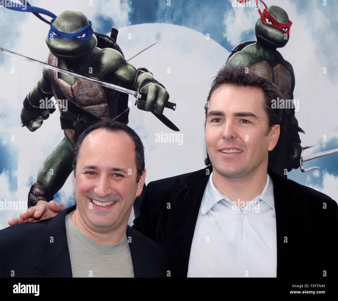 Nolan North (R), who voices the character Raphael and Mitchell